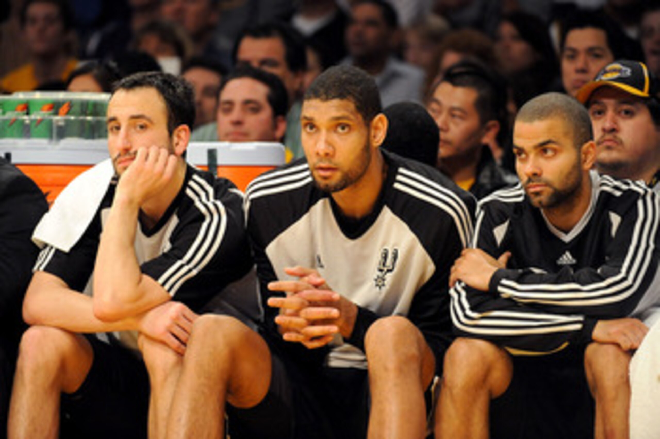 LOS ANGELES, CA - JANUARY 25:  (L-R) Manu Ginobili #20, Tim Duncan #21, and Tony Parker #9 of the San Antonio Spurs watch from the sidelines during the third quarter against the Los Angeles Lakers at the Staples Center on January 25, 2009 in Los Angeles,