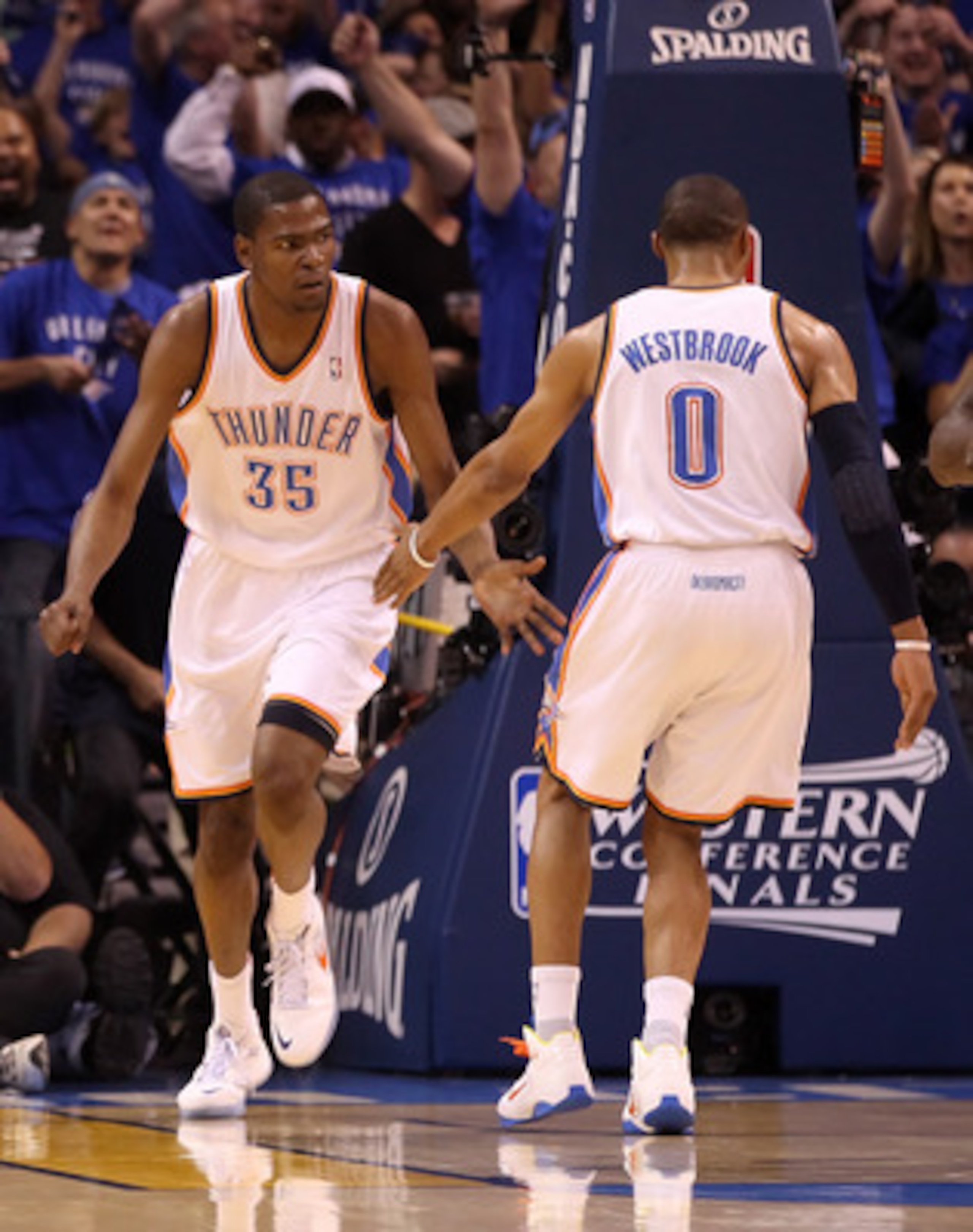 OKLAHOMA CITY, OK - MAY 23:  Kevin Durant #35 and Russell Westbrook #0 of the Oklahoma City Thunder react in the first half while taking on the Dallas Mavericks in Game Four of the Western Conference Finals during the 2011 NBA Playoffs at Oklahoma City Ar