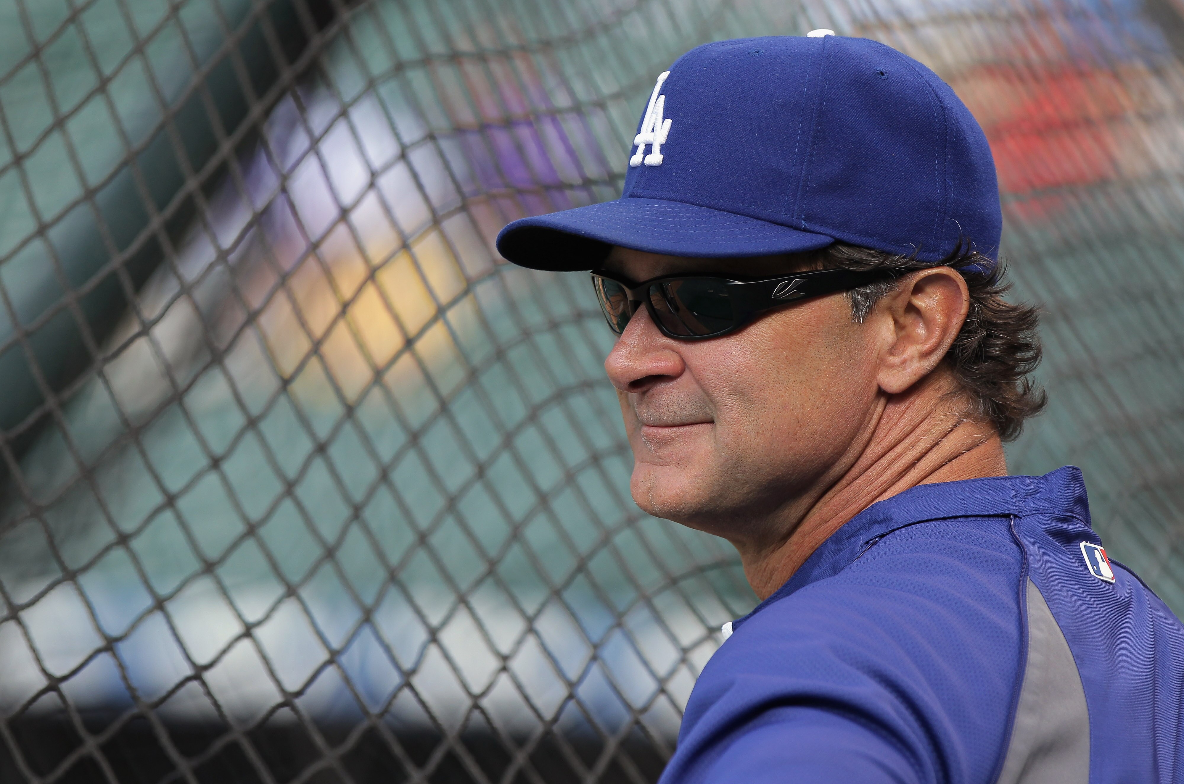 DENVER, CO - JUNE 10:  Manager Don Mattingly of the Los Angeles Dodgers looks on during batting practice prior to facing the Colorado Rockies at Coors Field on June 10, 2011 in Denver, Colorado.  (Photo by Doug Pensinger/Getty Images)