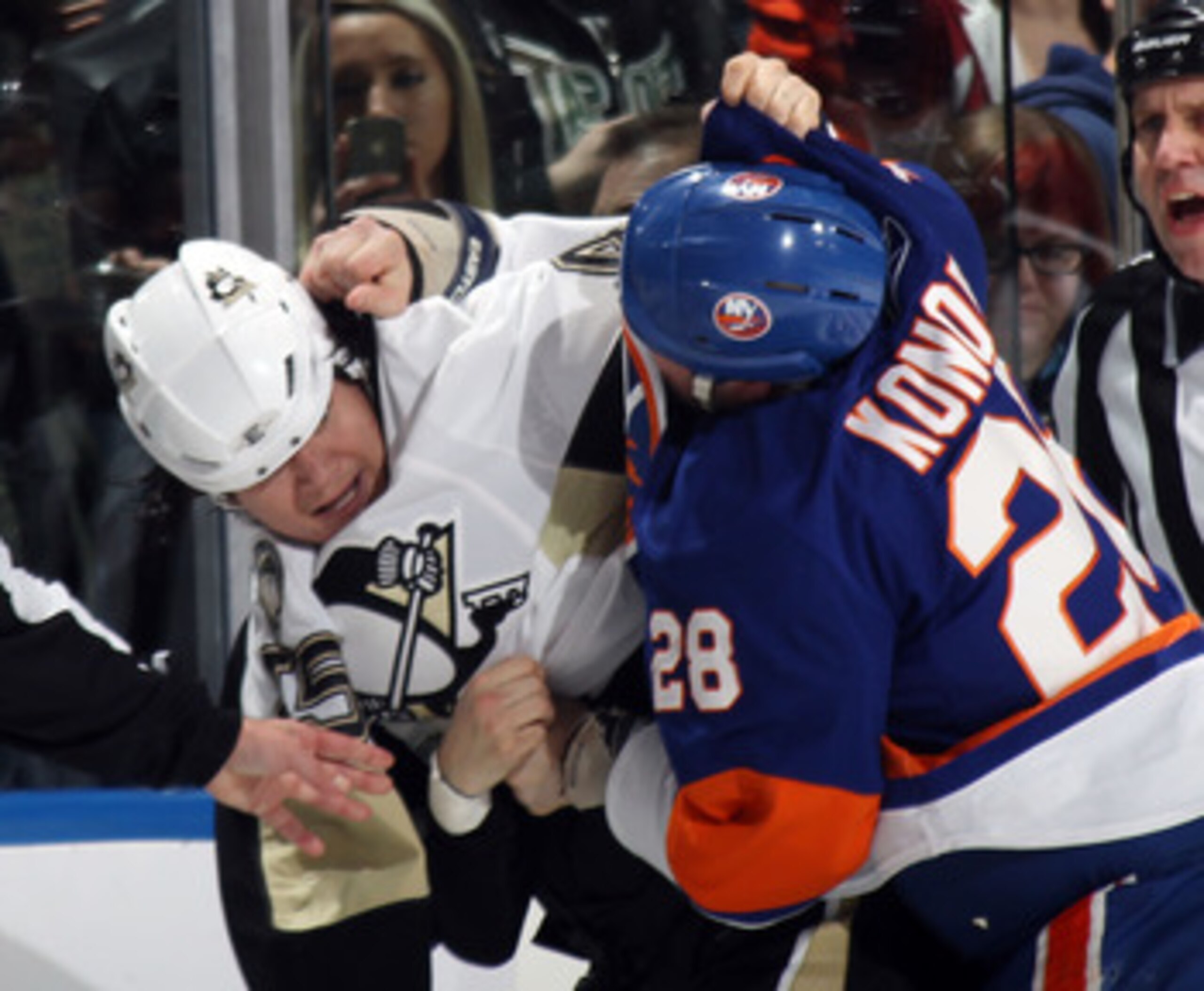UNIONDALE, NY - APRIL 08:  Arron Asham #45 of the Pittsburgh Penguins fights with Zenon Konopka #28 of the New York Islanders in the first period at the Nassau Coliseum on April 8, 2011 in Uniondale, New York.  (Photo by Bruce Bennett/Getty Images)