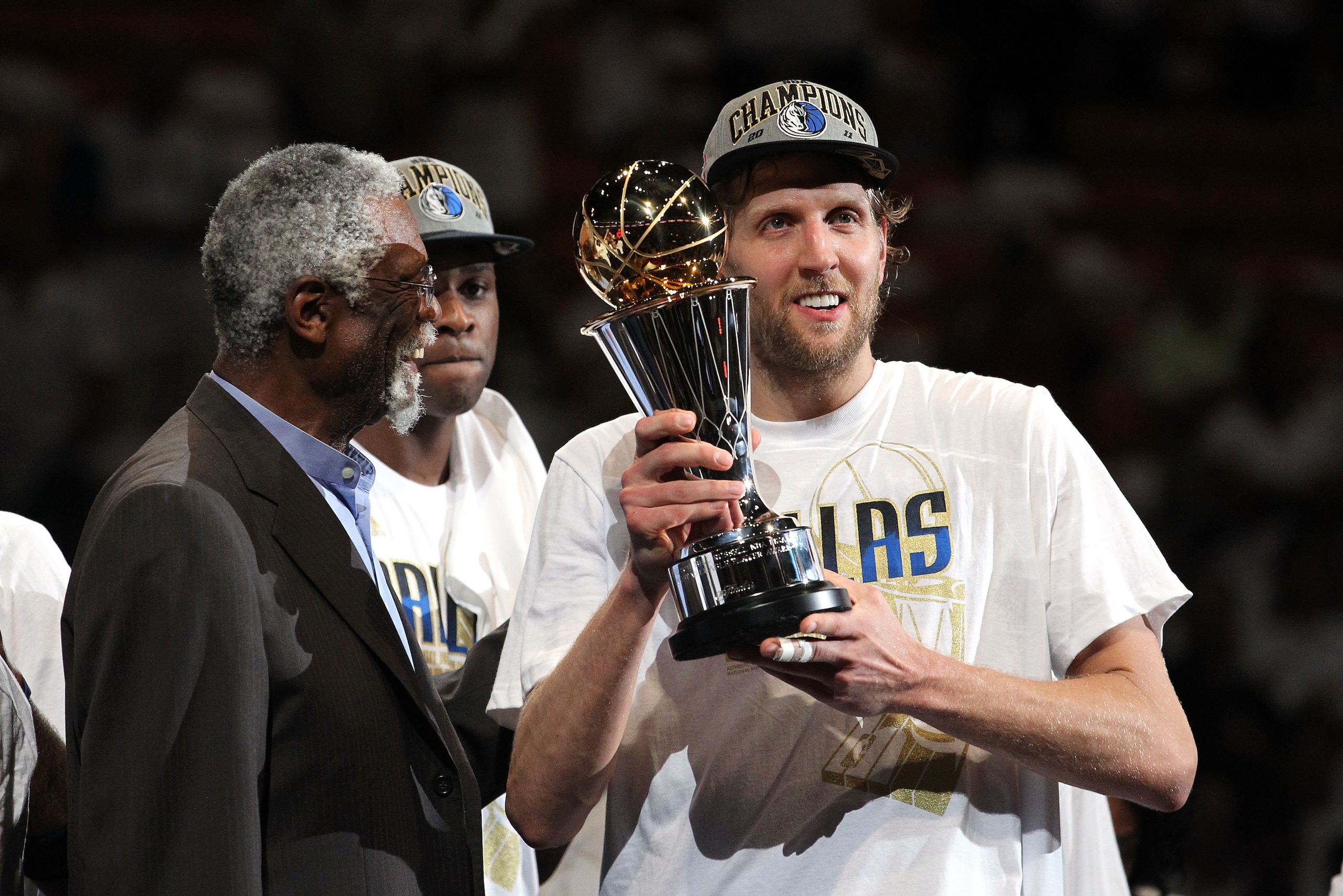 MIAMI, FL - JUNE 12:  Dirk Nowitzki #41 of the Dallas Mavericks holds up the Bill Russell Finals MVP trophy after Bill Russell presented it to him following the Mavericks 105-95 win against the Miami Heat in Game Six of the 2011 NBA Finals at American Air