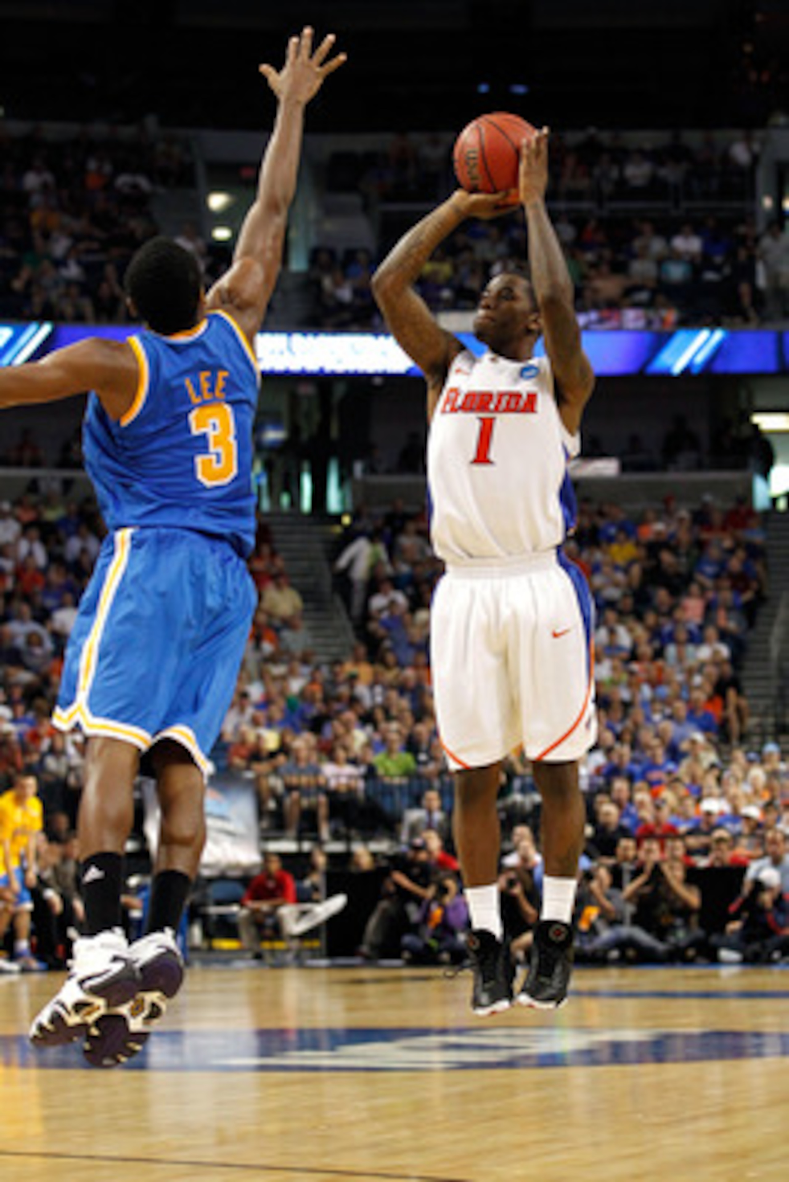 TAMPA, FL - MARCH 19: Kenny Boynton #1 of the Florida Gators attempts a shot against Malcolm Lee #3 of the UCLA Bruins during the third round of the 2011 NCAA men's basketball tournament at St. Pete Times Forum on March 19, 2011 in Tampa, Florida. Florid TAMPA, FL - MARCH 19: Kenny Boynton #1 of the Florida Gators attempts a shot against Malcolm Lee #3 of the UCLA Bruins during the third round of the 2011 NCAA men's basketball tournament at St. Pete Times Forum on March 19, 2011 in Tampa, Florida. Florid