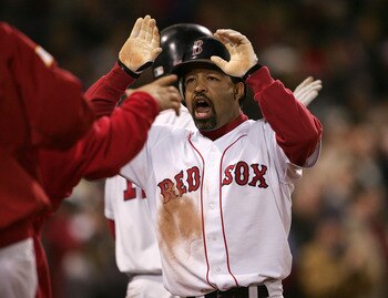 BOSTON - OCTOBER 18:  Dave Roberts #31 of the Boston Red Sox celebrates with his teammates after scoring on a game tying sacrafice fly-out by teammate Jason Varitek #33 in the eighth inning against the New York Yankees during game five of the American Lea
