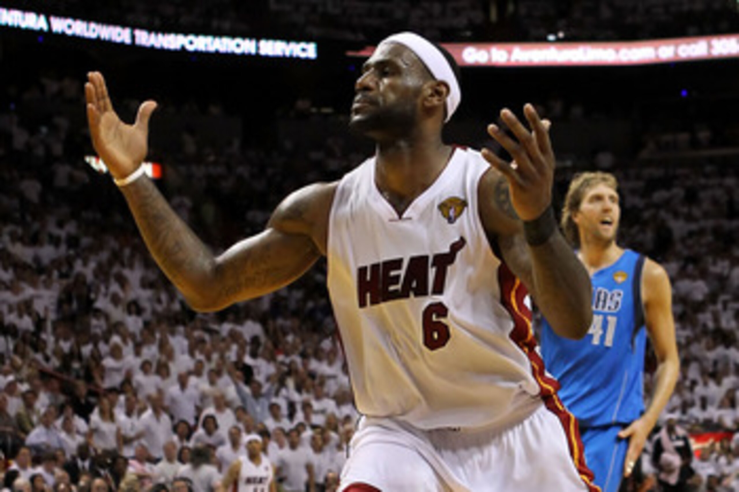 MIAMI, FL - JUNE 12:  LeBron James #6 of the Miami Heat reacts in front of Dirk Nowitzki #41 of the Dallas Mavericks in Game Six of the 2011 NBA Finals at American Airlines Arena on June 12, 2011 in Miami, Florida. NOTE TO USER: User expressly acknowledge