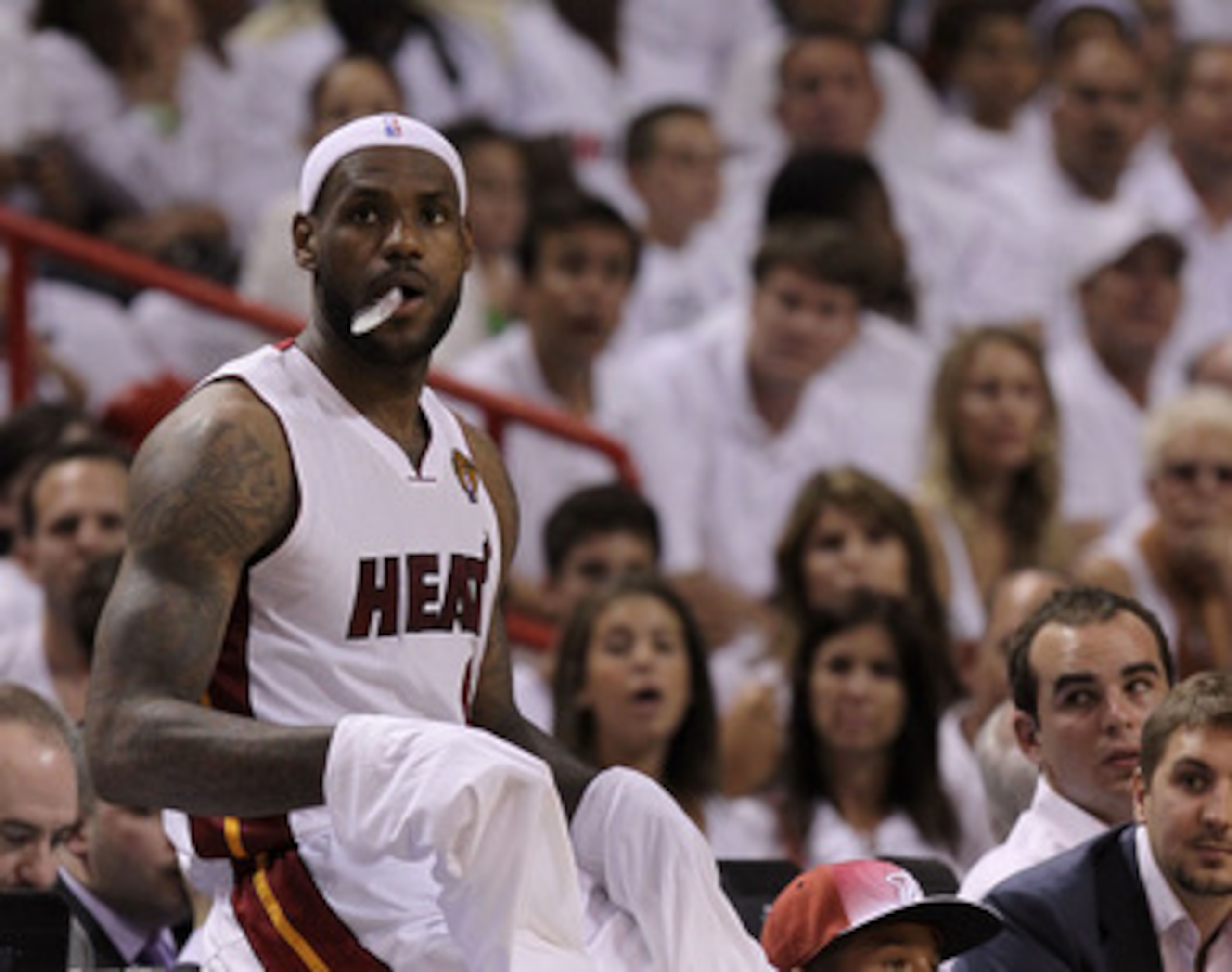 MIAMI, FL - JUNE 12:  LeBron James #6 of the Miami Heat sits on the scorer's table against the Dallas Mavericks in Game Six of the 2011 NBA Finals at American Airlines Arena on June 12, 2011 in Miami, Florida. NOTE TO USER: User expressly acknowledges and