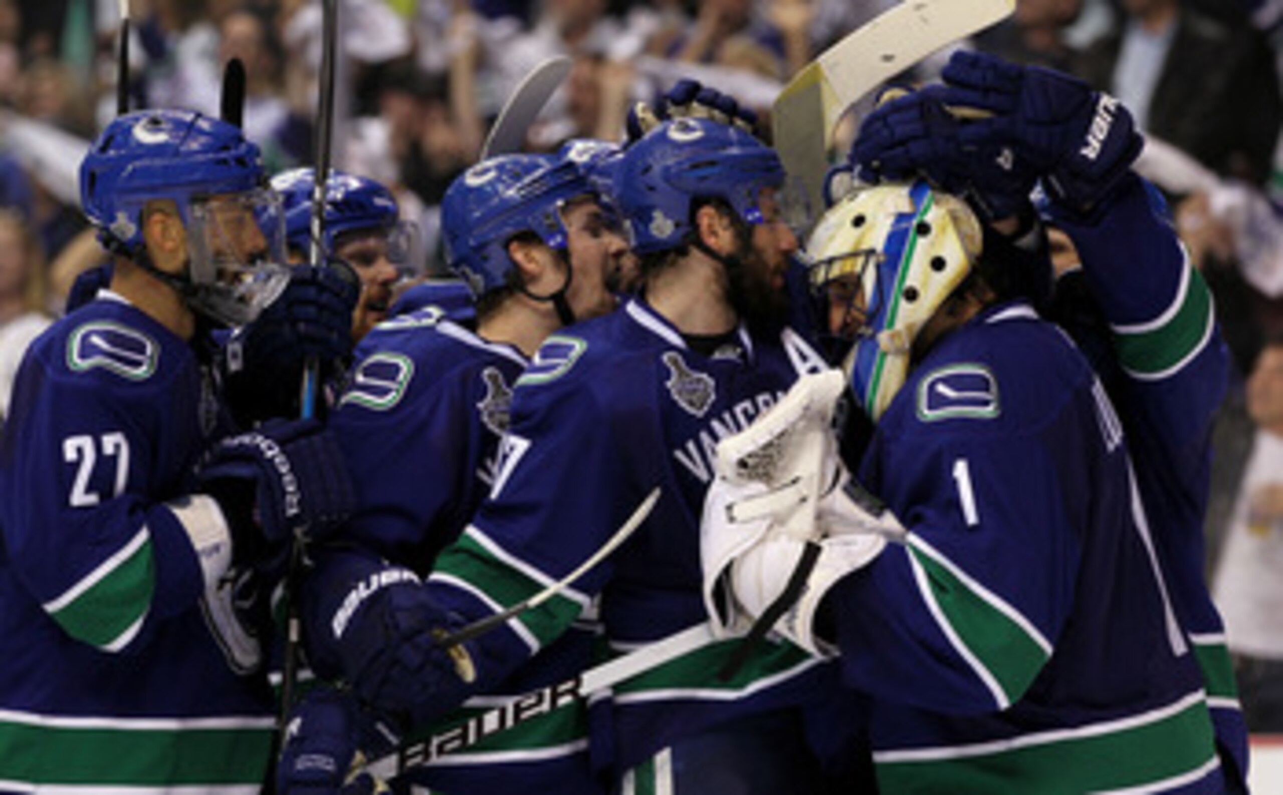 VANCOUVER, BC - JUNE 10:  Roberto Luongo #1, Alexander Edler #23 and Ryan Kesler #17 and the Vancouver Canucks celebrate after defeating the Boston Bruins by a score of 1-0 in Game Five of the 2011 NHL Stanley Cup Final at Rogers Arena on June 10, 2011 in