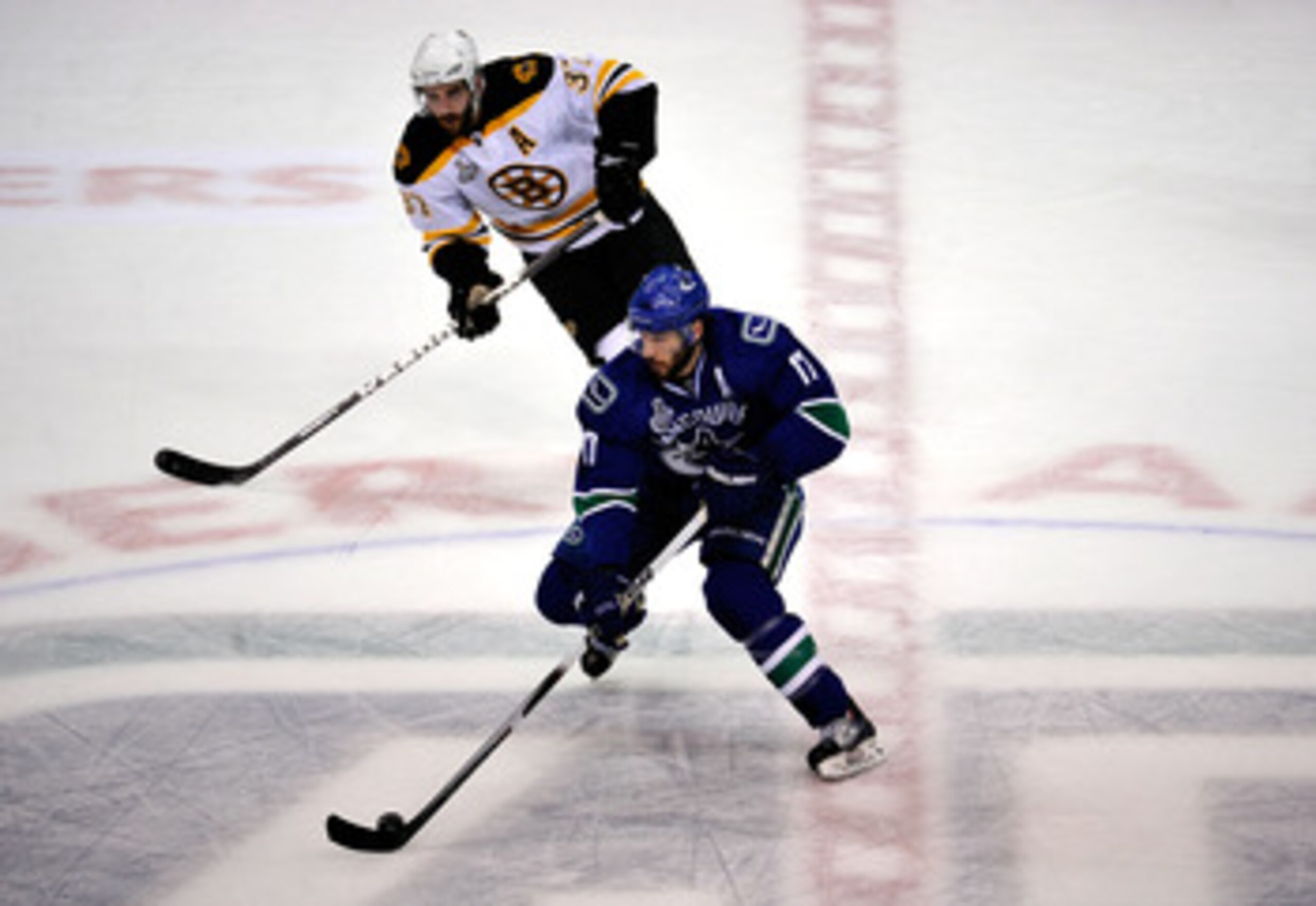 VANCOUVER, BC - JUNE 01:  Ryan Kesler #17 of the Vancouver Canucks skates against Patrice Bergeron #37 of the Boston Bruins during game one of the 2011 NHL Stanley Cup Finals at Rogers Arena on June 1, 2011 in Vancouver, Canada.  (Photo by Rich Lam/Getty