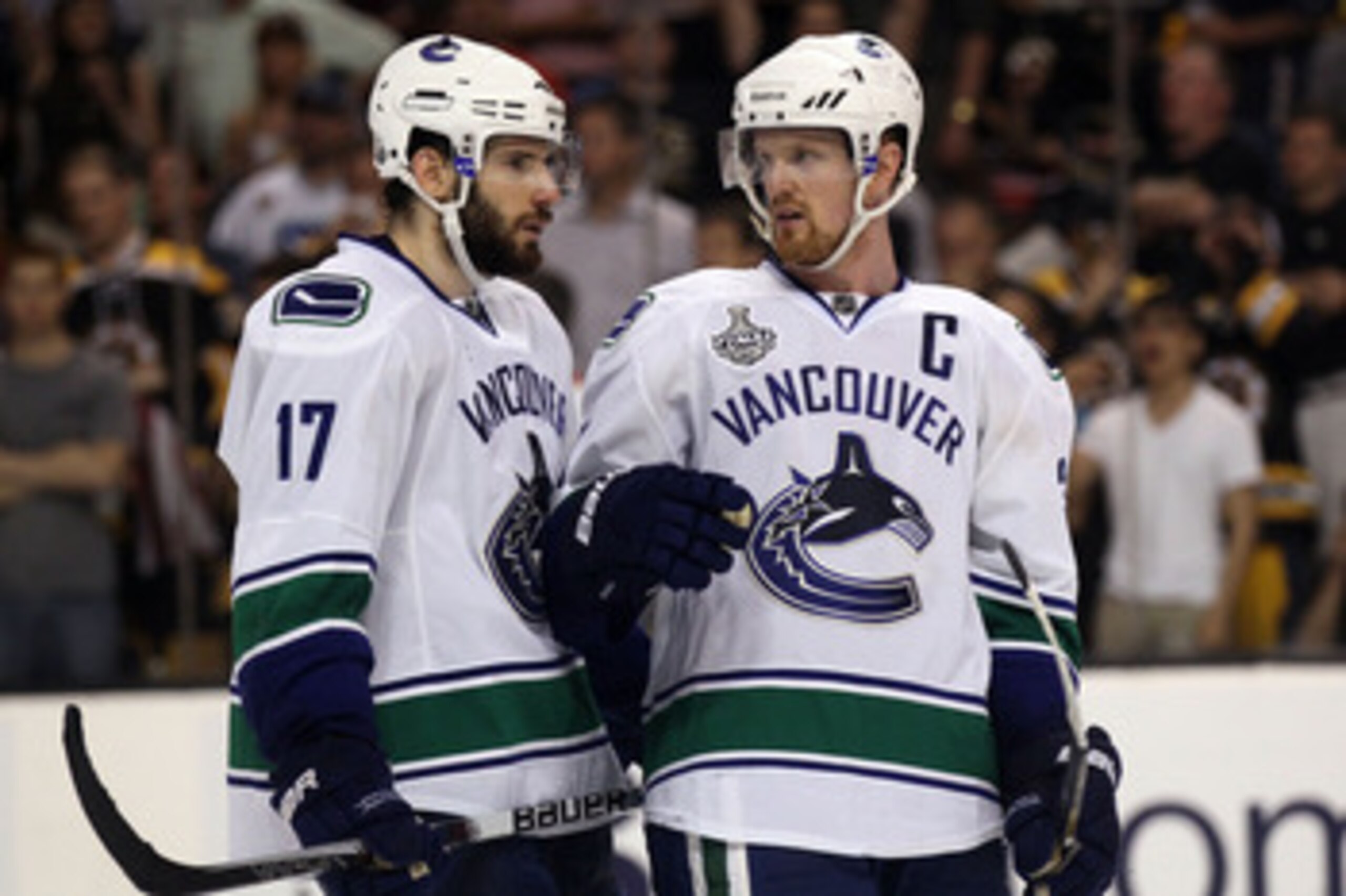 BOSTON, MA - JUNE 08:  Ryan Kesler #17 of the Vancouver Canucks talks with teammate Henrik Sedin #33 during Game Four against the Boston Bruins in the 2011 NHL Stanley Cup Final at TD Garden on June 8, 2011 in Boston, Massachusetts.  (Photo by Elsa/Getty