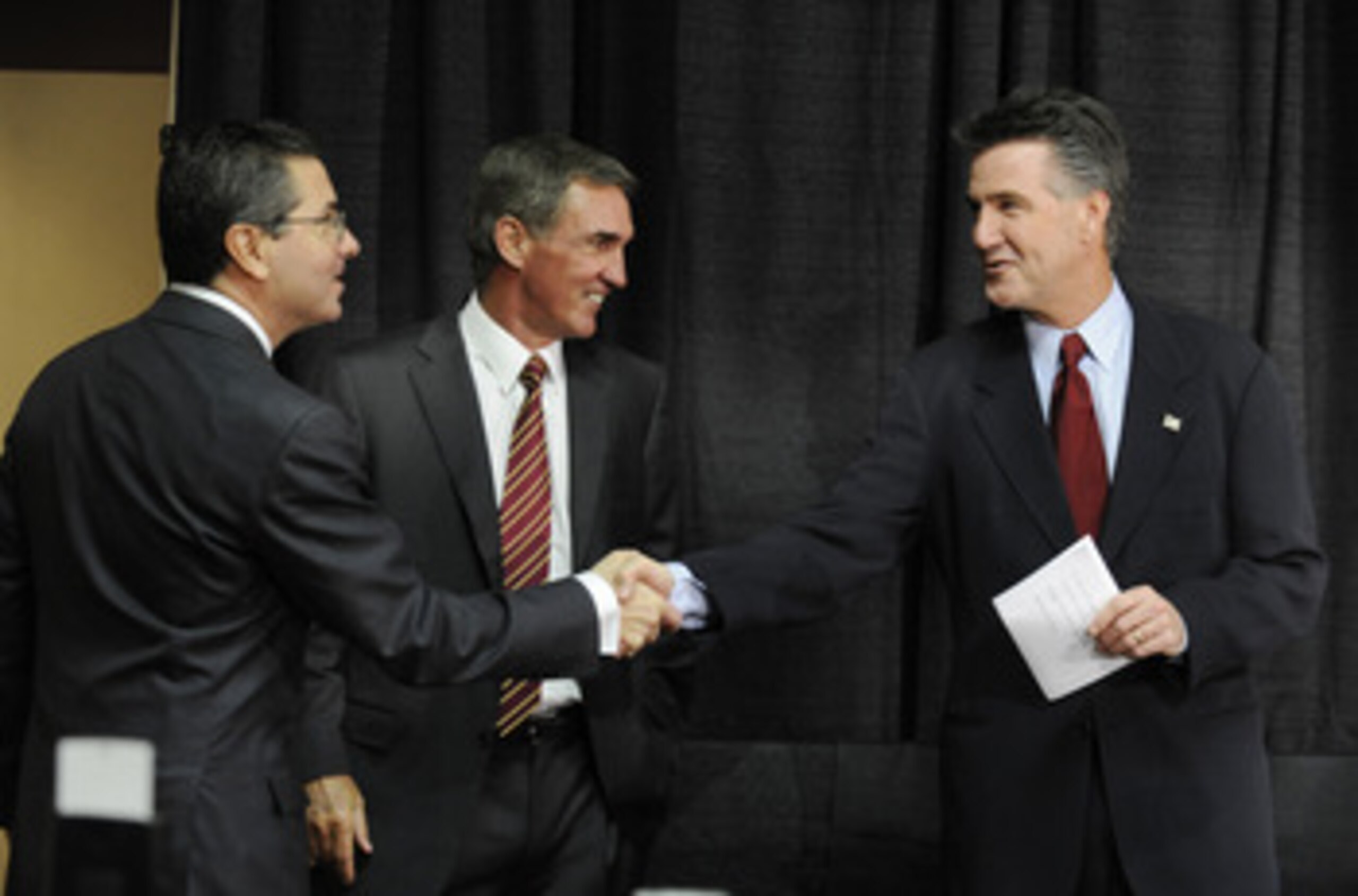 ASHBURN,VA - JANUARY 6:  Dan Snyder, owner of the Washington Redskins, Mike Shanahan the new Executive Vice President and head coach, and Bruce Allen Executive Vice President,  before a press conference welcoming Shanahan to the Redskins on January 6, 201