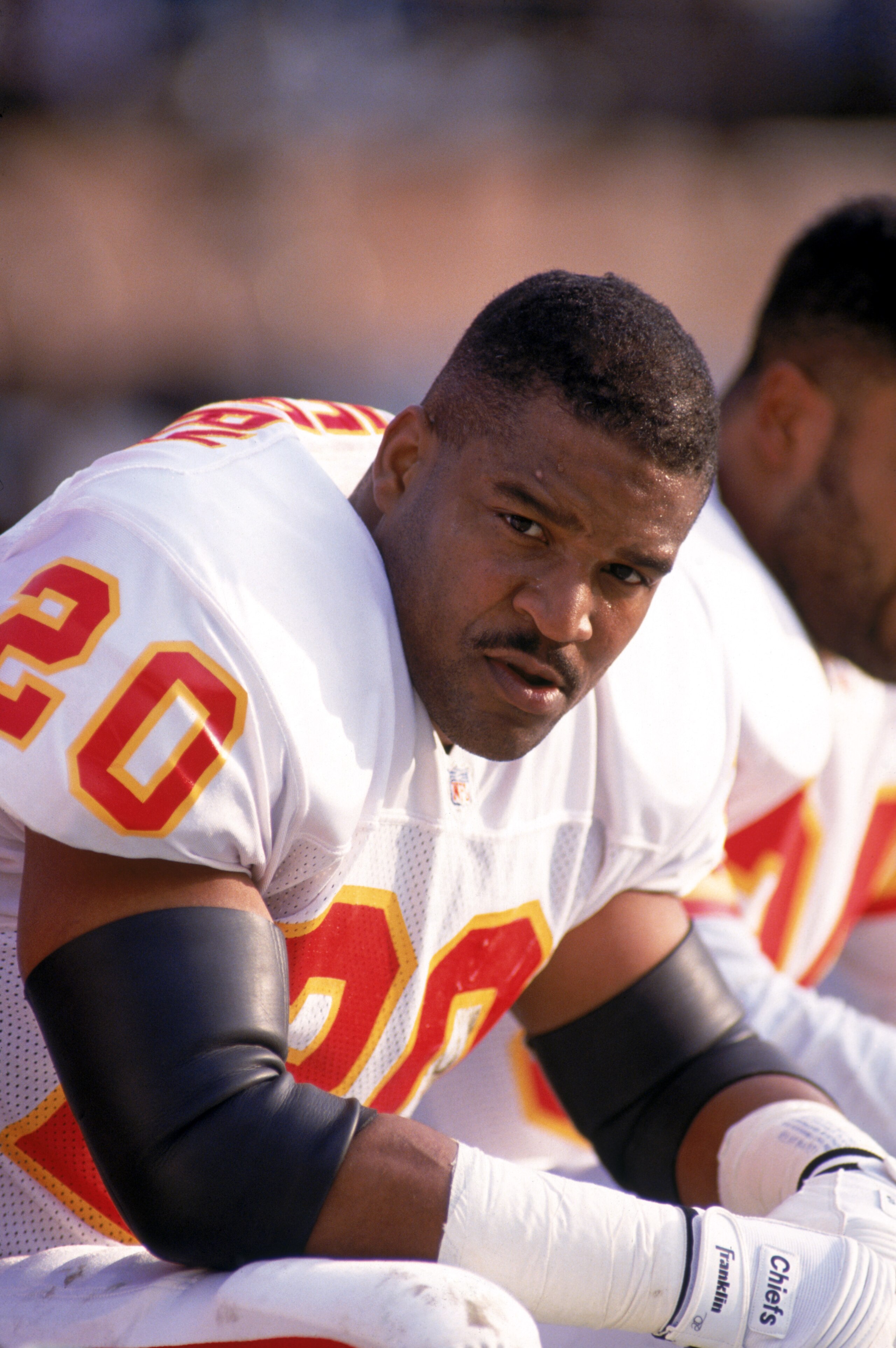 SAN FRANCISCO - DECEMBER 14:  Defensive back Deron Cherry #20 of the Kansas City Chiefs takes a rest on the sideline bench during a game against the San Francisco 49ers at Candlestick Park on December 14, 1991 in San Francisco, California.  The 49ers won