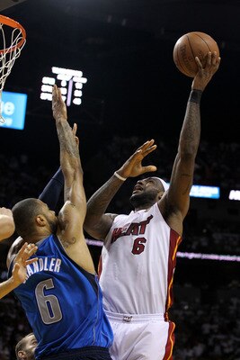 MIAMI, FL - JUNE 12:  LeBron James #6 of the Miami Heat attempts a shot against Tyson Chandler #6 of the Dallas Mavericks in Game Six of the 2011 NBA Finals at American Airlines Arena on June 12, 2011 in Miami, Florida. NOTE TO USER: User expressly acknow