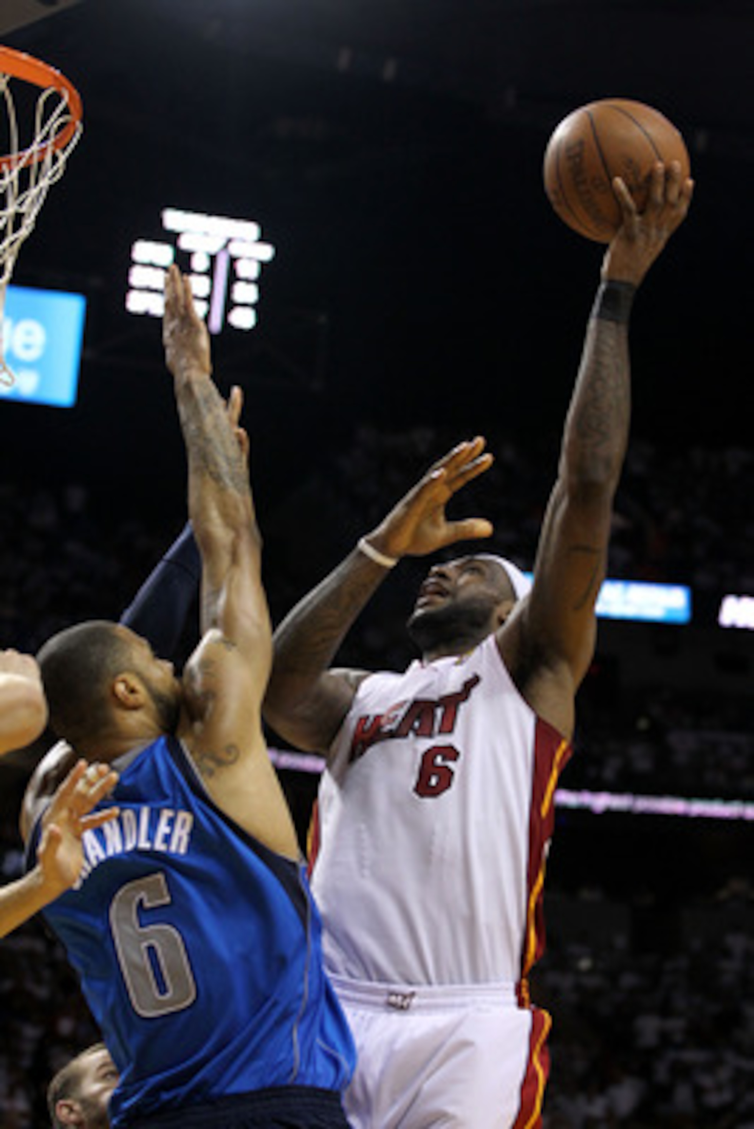 MIAMI, FL - JUNE 12:  LeBron James #6 of the Miami Heat attempts a shot against Tyson Chandler #6 of the Dallas Mavericks in Game Six of the 2011 NBA Finals at American Airlines Arena on June 12, 2011 in Miami, Florida. NOTE TO USER: User expressly acknow