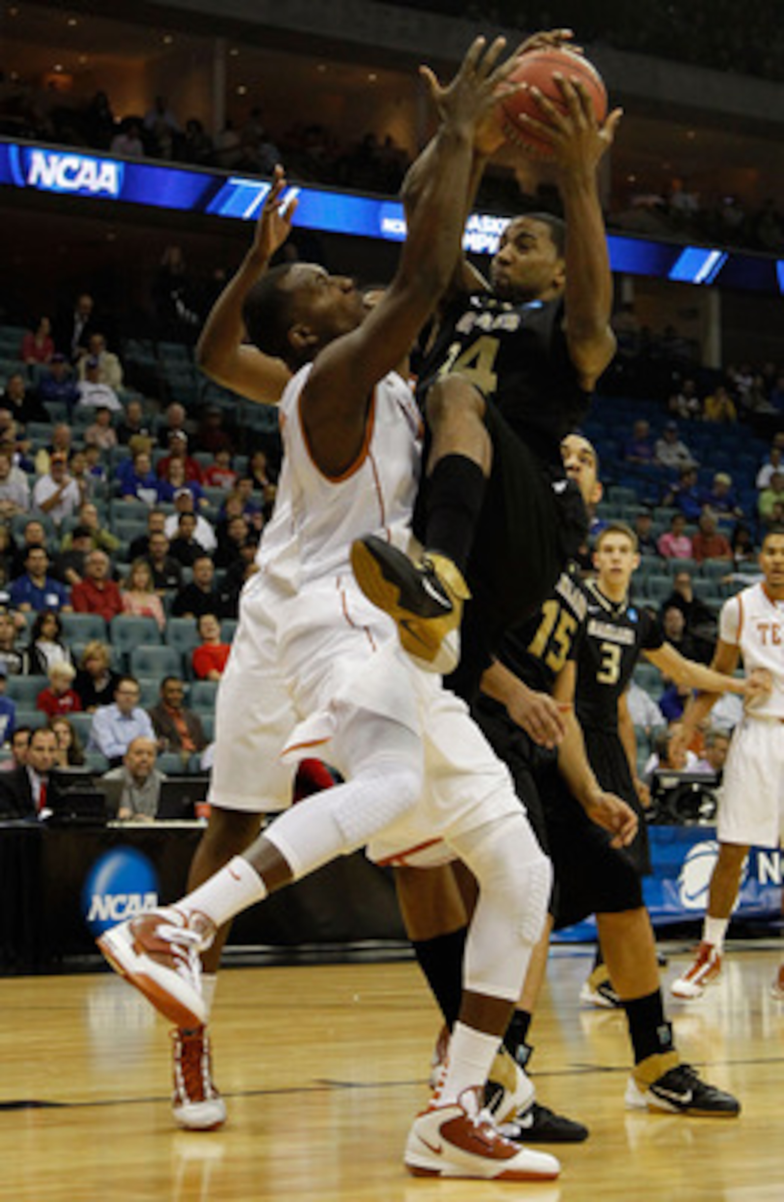 TULSA, OK - MARCH 18:  Keith Benson #34 of the Oakland Golden Grizzlies goes up for a shot against Jordan Hamilton #3 of the Texas Longhorns during the second round of the 2011 NCAA men's basketball tournament at BOK Center on March 18, 2011 in Tulsa, Okl