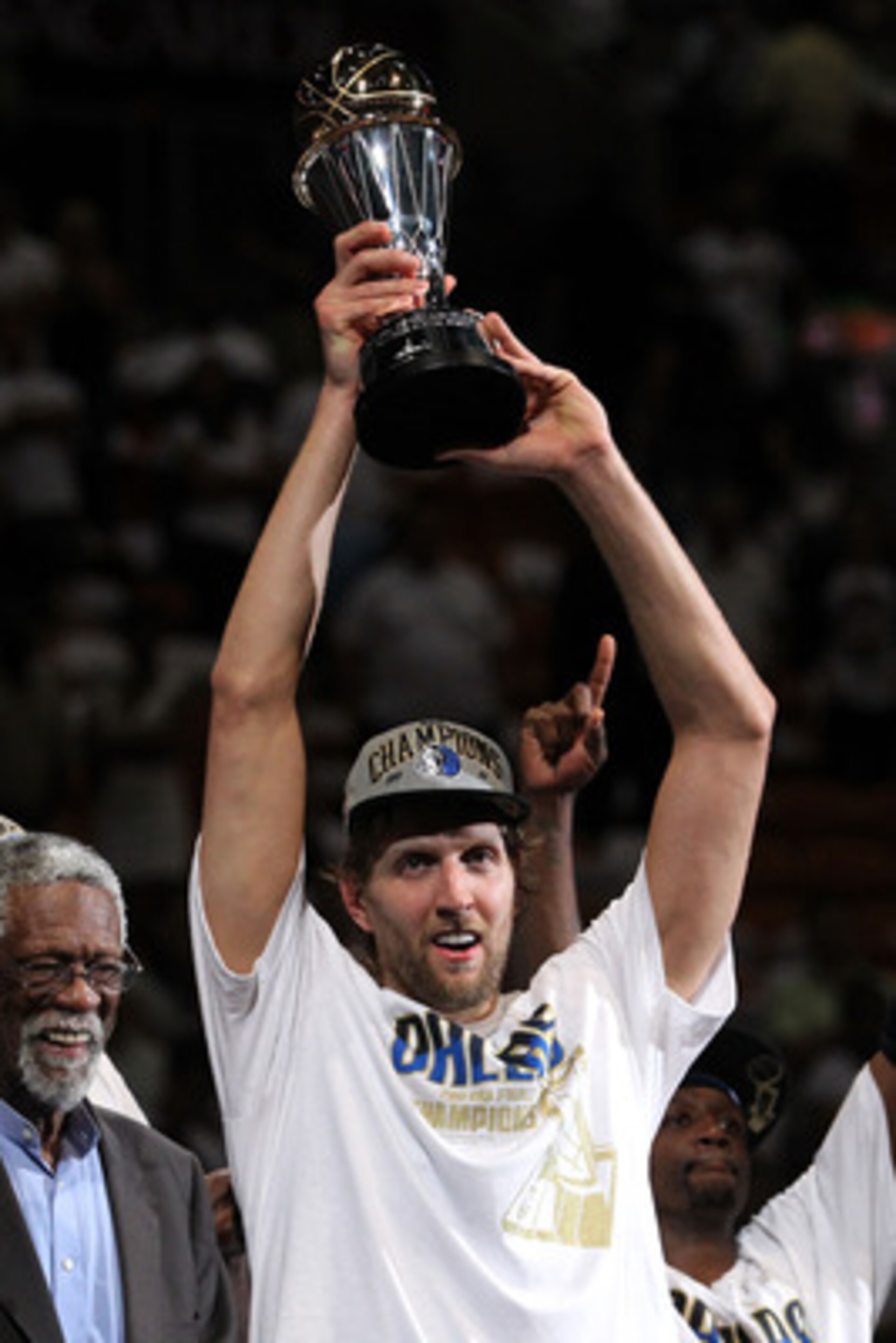 MIAMI, FL - JUNE 12:  Dirk Nowitzki #41 of the Dallas Mavericks holds up the Bill Russell Finals MVP trophy after Bill Russell presented it to him following the Mavericks 105-95 win against the Miami Heat in Game Six of the 2011 NBA Finals at American Air