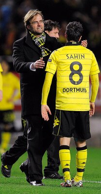 SEVILLE, SPAIN - DECEMBER 15:  Head coach Jurgen Klopp of Borussia Dortmund (L) conforts to Nuri Sahin at the end of the UEFA Europa League group J match between Sevilla and Borussia Dortmund at Estadio Ramon Sanchez Pizjuan on December 15, 2010 in Sevill