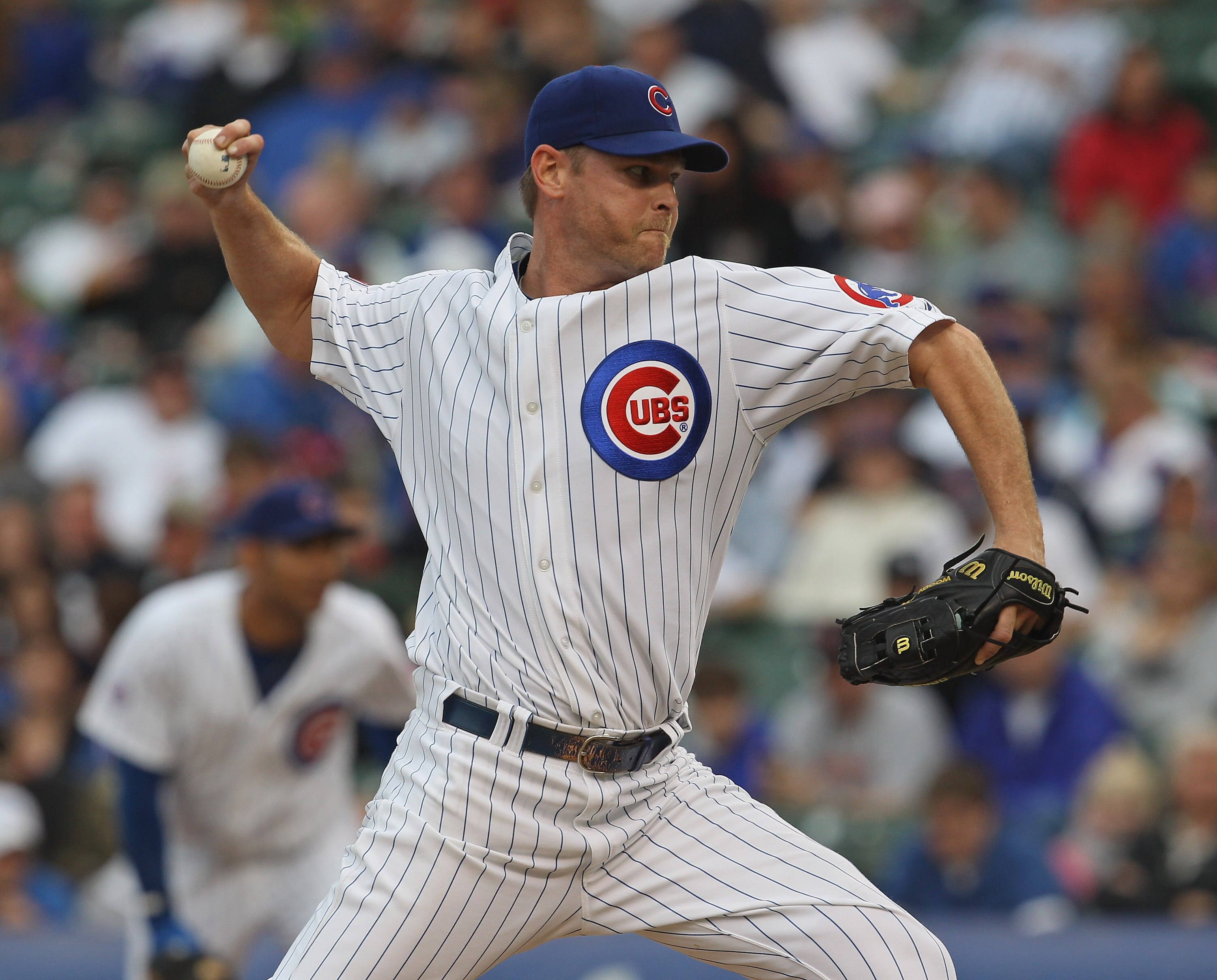 CHICAGO, IL - MAY 29: Kerry Wood #34 of the Chicago Cubs delivers the ball against the Pittsburgh Pirates at Wrigley Field on May 29, 2011 in Chicago, Illinois. The Cubs defeated the Pirates 3-2.  (Photo by Jonathan Daniel/Getty Images)