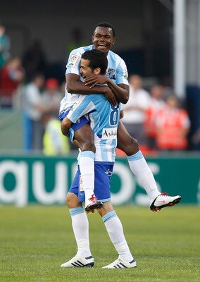 MALAGA, SPAIN - MAY 16:  Felipe Caicedo and Fernando Fernandez of Malaga celebrate after the La Liga match between Malaga and Real Madrid at La Rosaleda Stadium on May 16, 2010 in Malaga, Spain.  (Photo by Angel Martinez/Getty Images)