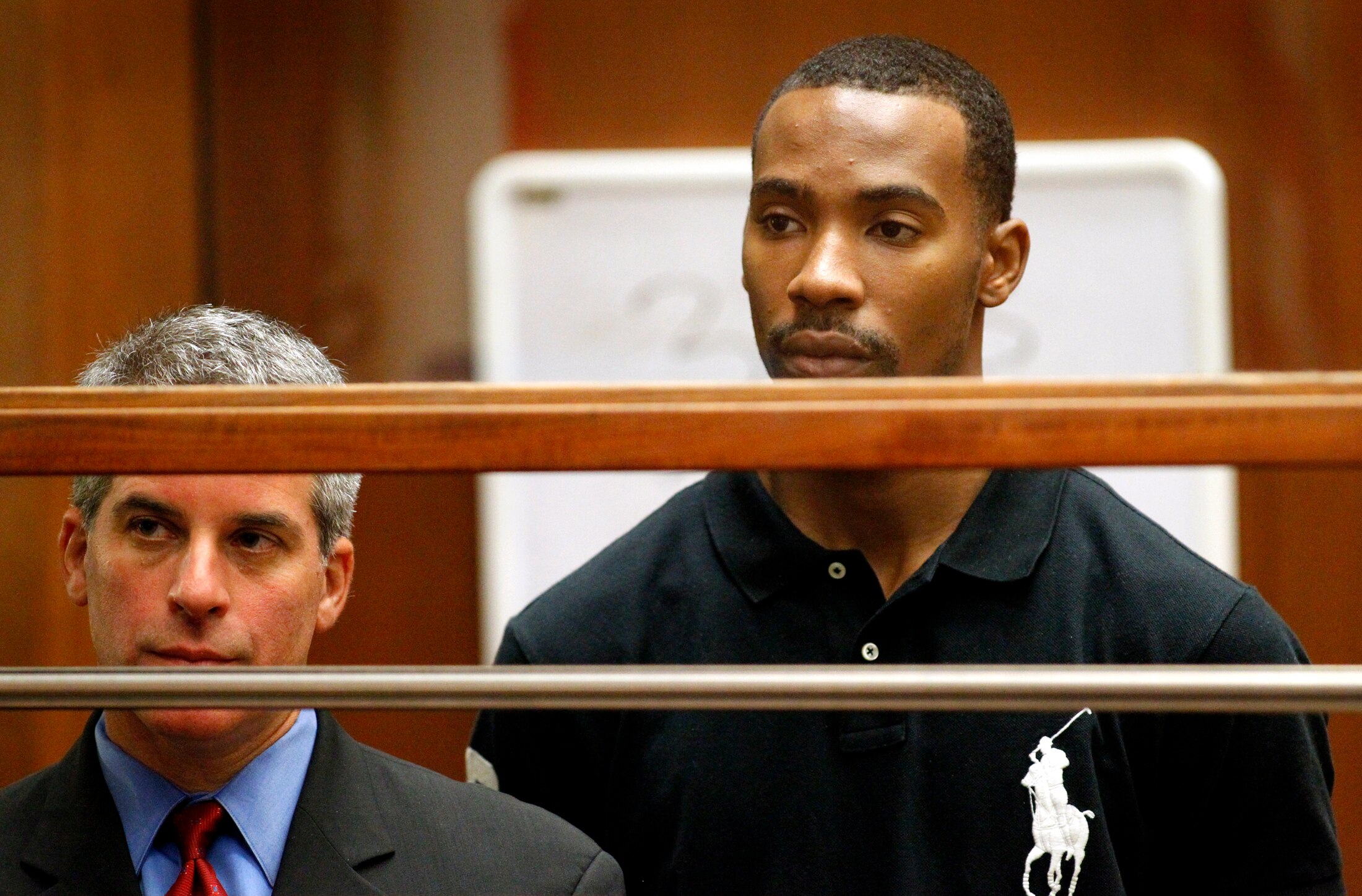 LOS ANGELES, CA - AUGUST 31:  Former Los Angeles Lakers guard Javaris Crittenton (R) appears in Los Angeles Superior Court for an extradition hearing with his attorney Brian Steel August 31, 2011 in Los Angeles, California. The hearing wasin connection wi