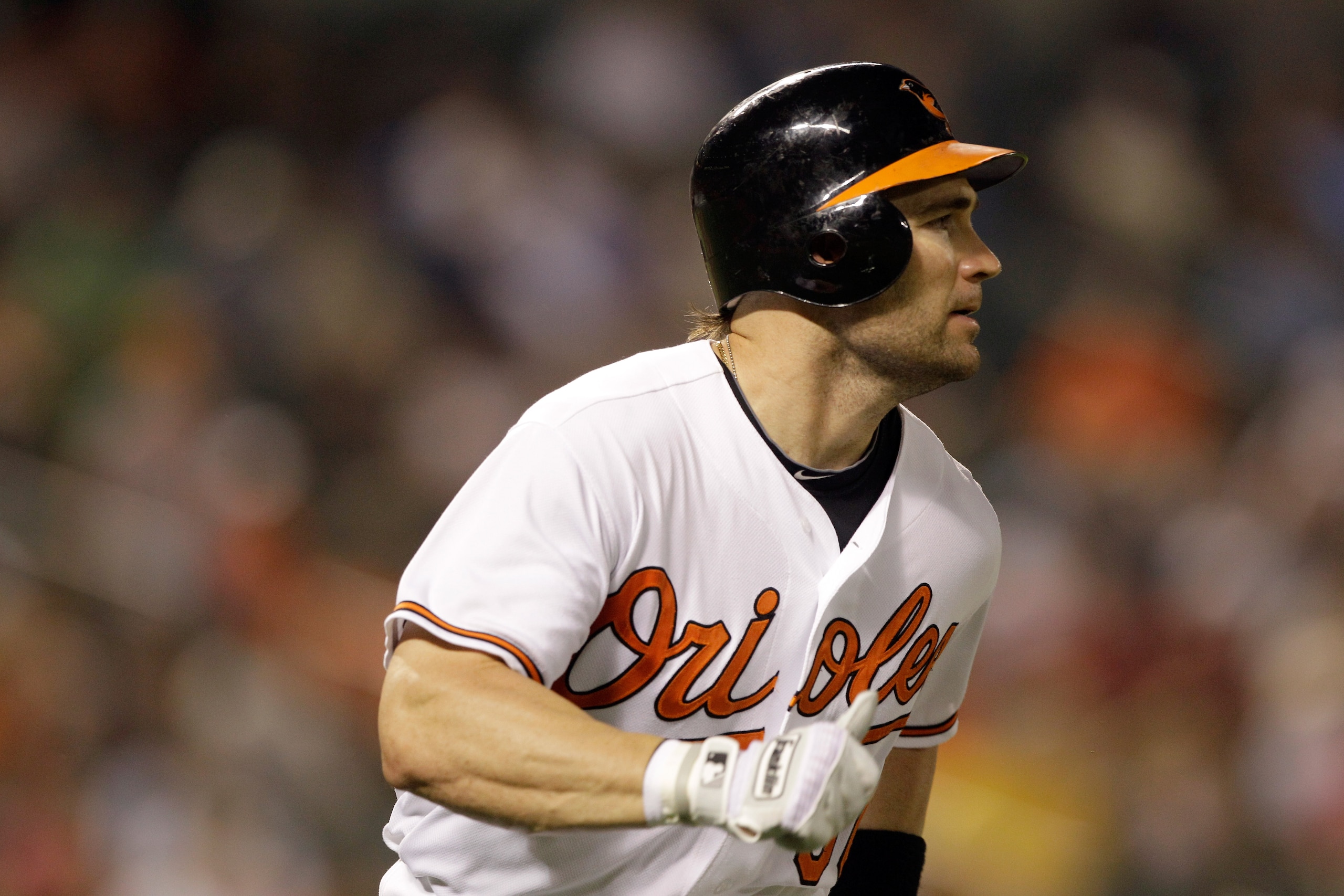 BALTIMORE, MD - JUNE 07:  Luke Scott #30 of the Baltimore Orioles follows his seventh inning doiuble against the Oakland Athletics at Oriole Park at Camden Yards on June 7, 2011 in Baltimore, Maryland. The Baltimore Orioles defeated the Oakland Athletics