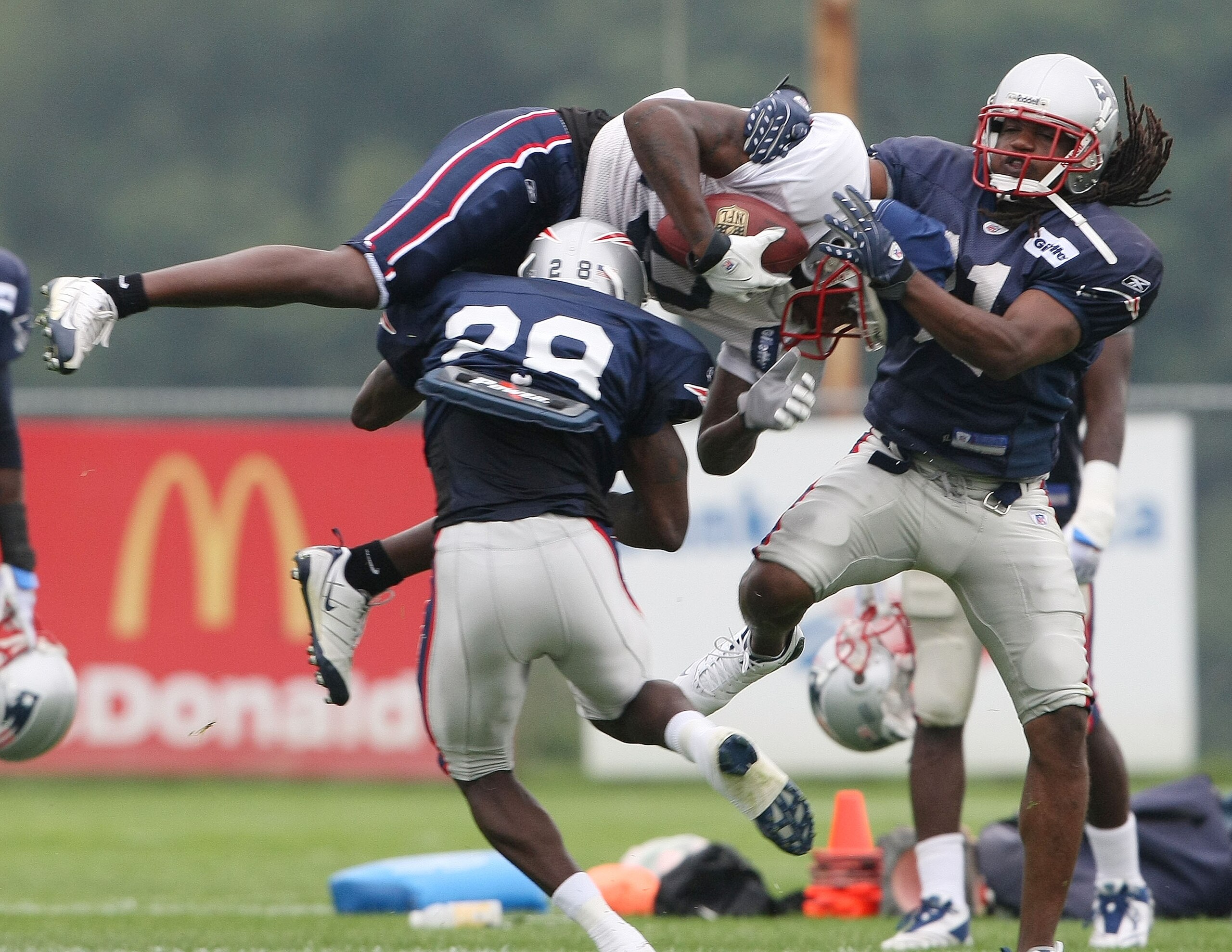 FOXBORO, MA - JULY 31:  Brandon Meriweather #31 and Darius Butler #28 of the New England Patriots stop Terrence Nunn #10 during training camp on July 31, 2009 at Gillette Stadium in Foxboro, Massachusetts.  (Photo by Elsa/Getty Images)