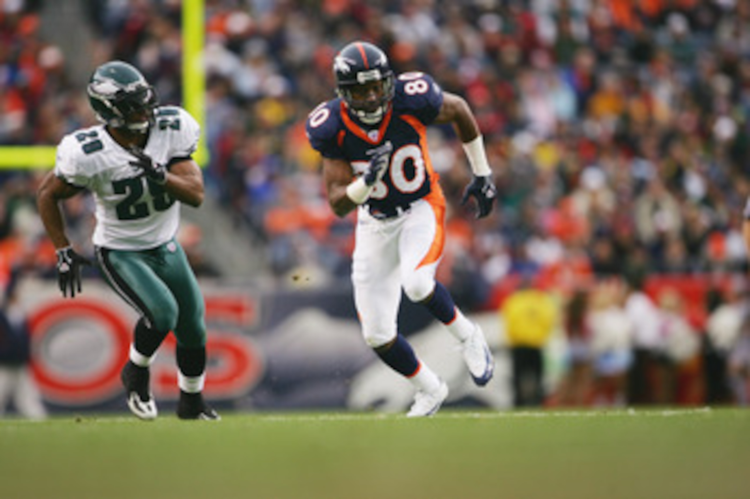 DENVER - OCTOBER 30:  Wide receiver Rod Smith #80 of the Denver Broncos runs a pass pattern against cornerback Roderick Hood #29 of the Philadelphia Eagles at INVESCO Field at Mile High on October 30, 2005 in Denver, Colorado. The Broncos defeated the Eag