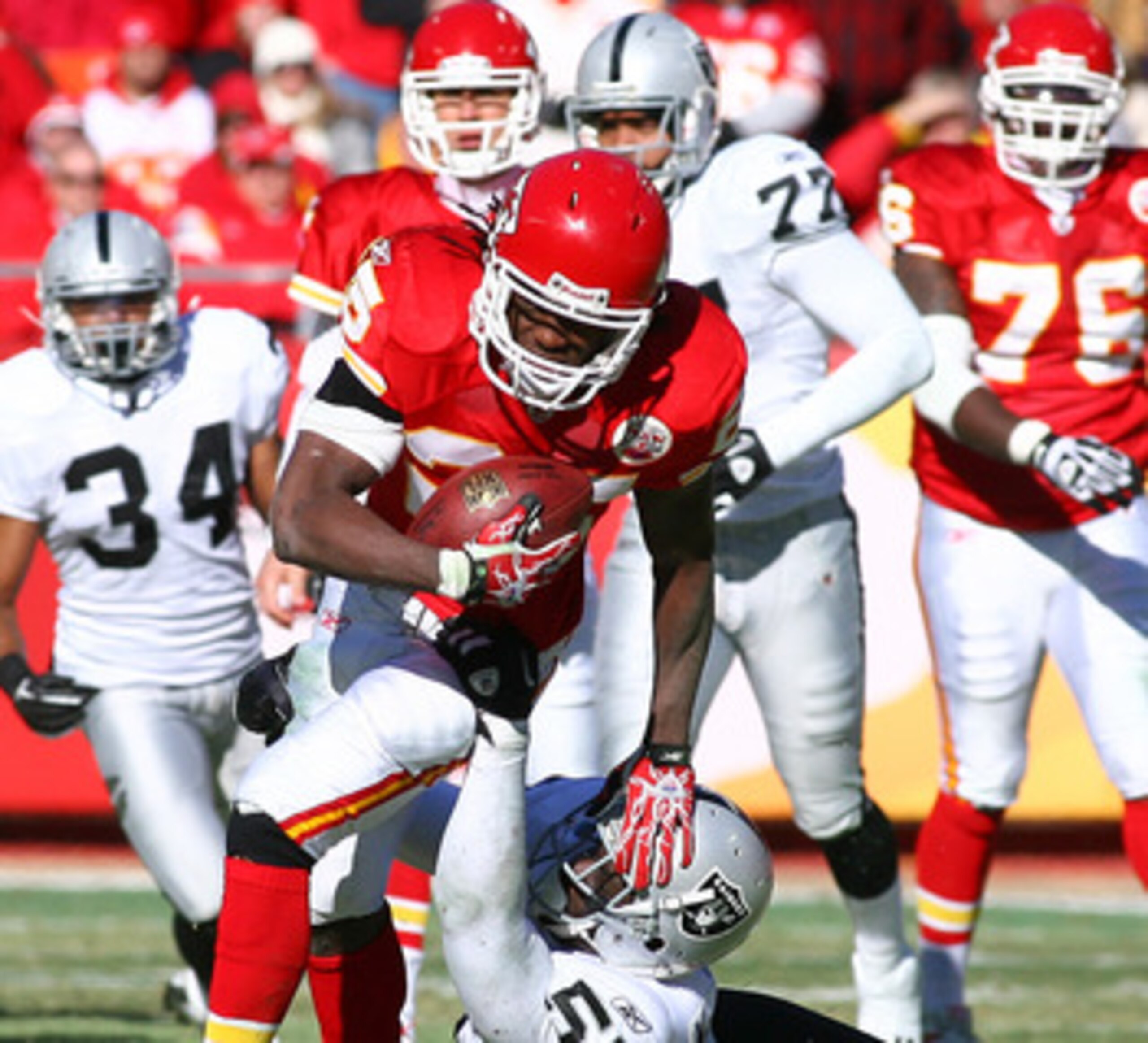KANSAS CITY, MO - JANUARY 02:  Running back Jamaal Charles #25 of the Kansas City Chiefs is tackled by linebacker Rolando McClain #55 of the Oakland Raiders in a game at Arrowhead Stadium on January 2, 2011 in Kansas City, Missouri.  (Photo by Tim Umphrey