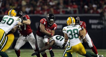 ATLANTA, GA - JANUARY 15:  Michael Turner #33 of the Atlanta Falcons runs the ball against the Green Bay Packers during their 2011 NFC divisional playoff game at Georgia Dome on January 15, 2011 in Atlanta, Georgia. The Packers won 48-21. (Photo by Street