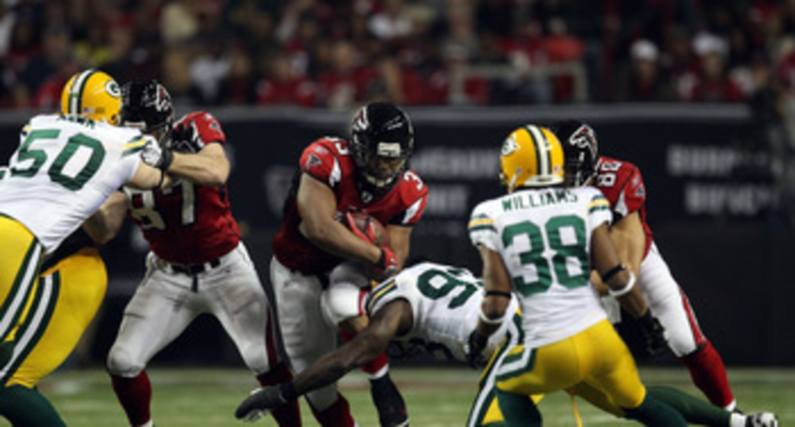 ATLANTA, GA - JANUARY 15:  Michael Turner #33 of the Atlanta Falcons runs the ball against the Green Bay Packers during their 2011 NFC divisional playoff game at Georgia Dome on January 15, 2011 in Atlanta, Georgia. The Packers won 48-21. (Photo by Street