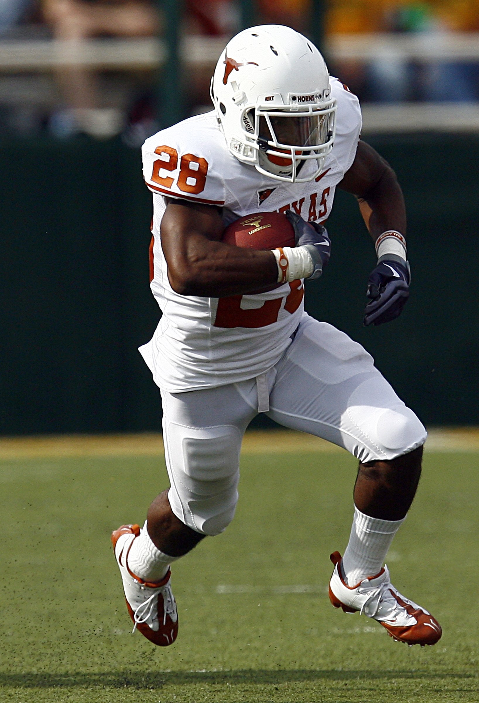 WACO, TX - NOVEMBER 14:  Running back Fozzy Whittaker #28 of the Texas Longhorns carries the ball in the first half against the Baylor Bears on November 14, 2009 at Floyd Casey Stadium in Waco, Texas.   The Longhorns beat the Bears 47-14.  (Photo by Tom P