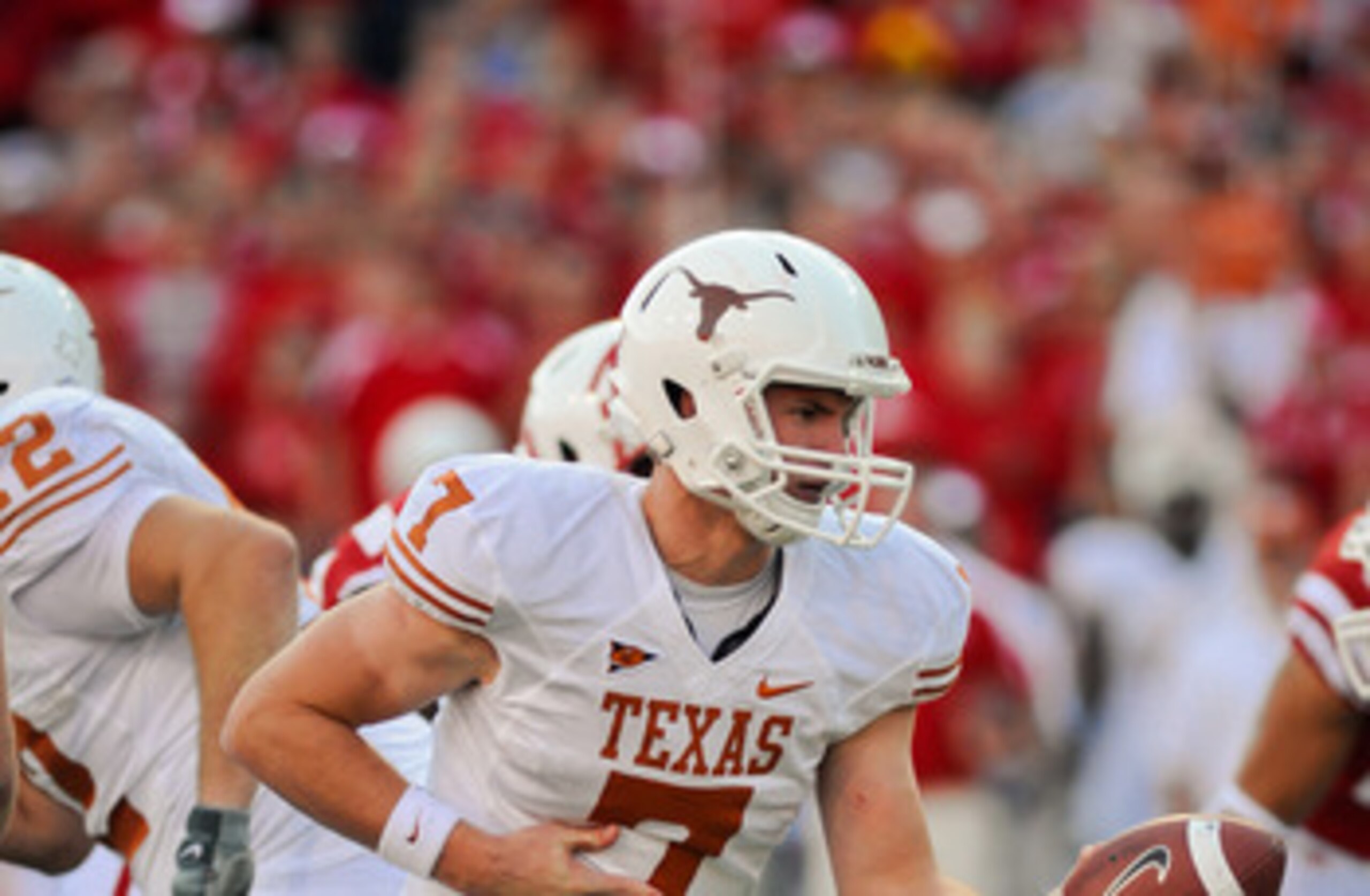 LINCOLN, NE - OCTOBER 16: Quarterback Garrett Gilbert #7 of the Texas Longhorns prepares to hand the ball off during their game at Memorial Stadium on October 16, 2010 in Lincoln, Nebraska. Texas Defeated Nebraska 20-13. (Photo by Eric Francis/Getty Image
