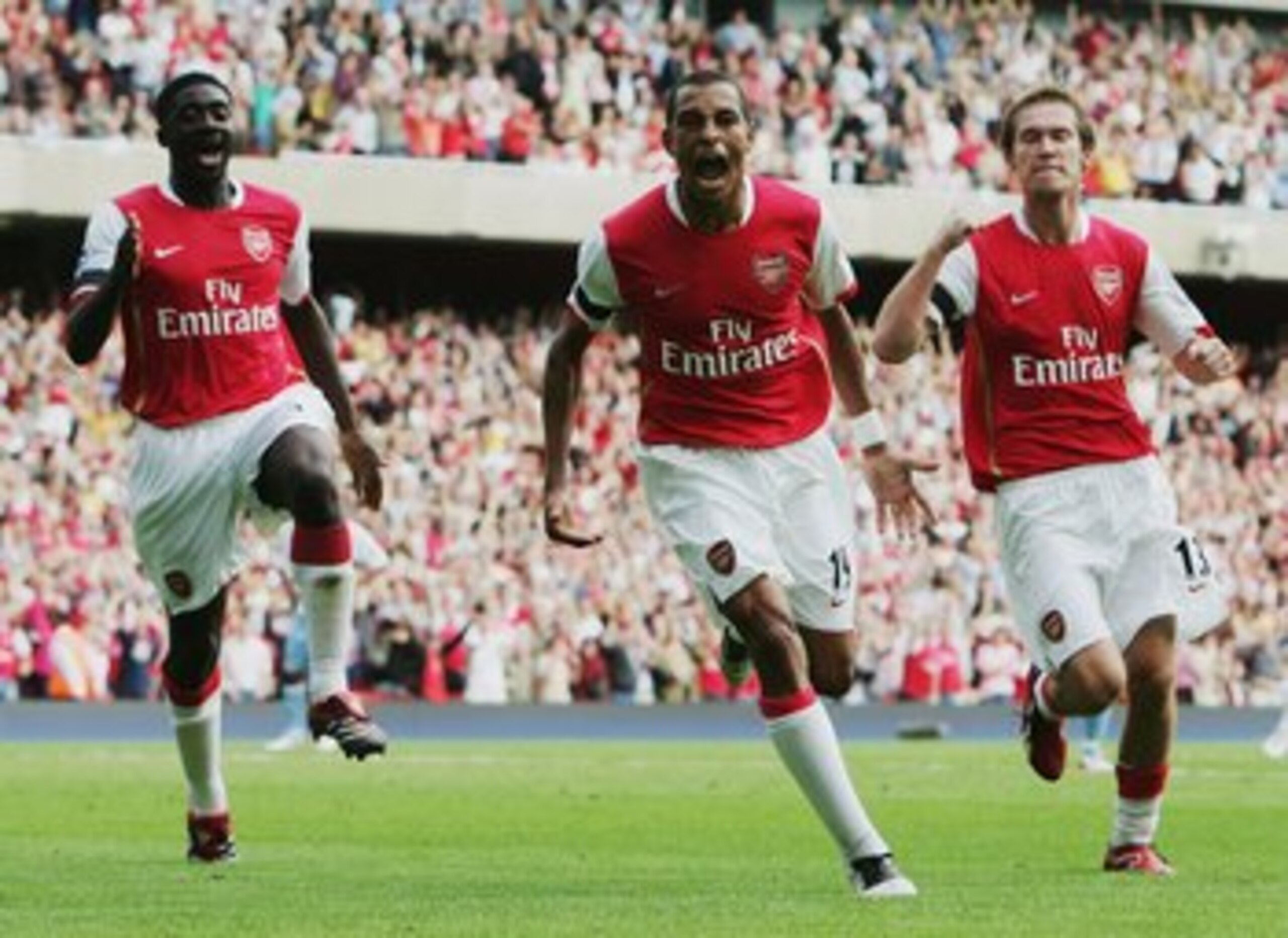 LONDON - AUGUST 19:  Gilberto (C) of Arsenal celebrates with team mates Kolo Toure (L) and Alexander Hleb (R) after scoring the equalising goal during the Barclays Premiership match between Arsenal and Aston Villa at The Emirates Stadium on August 19, 200