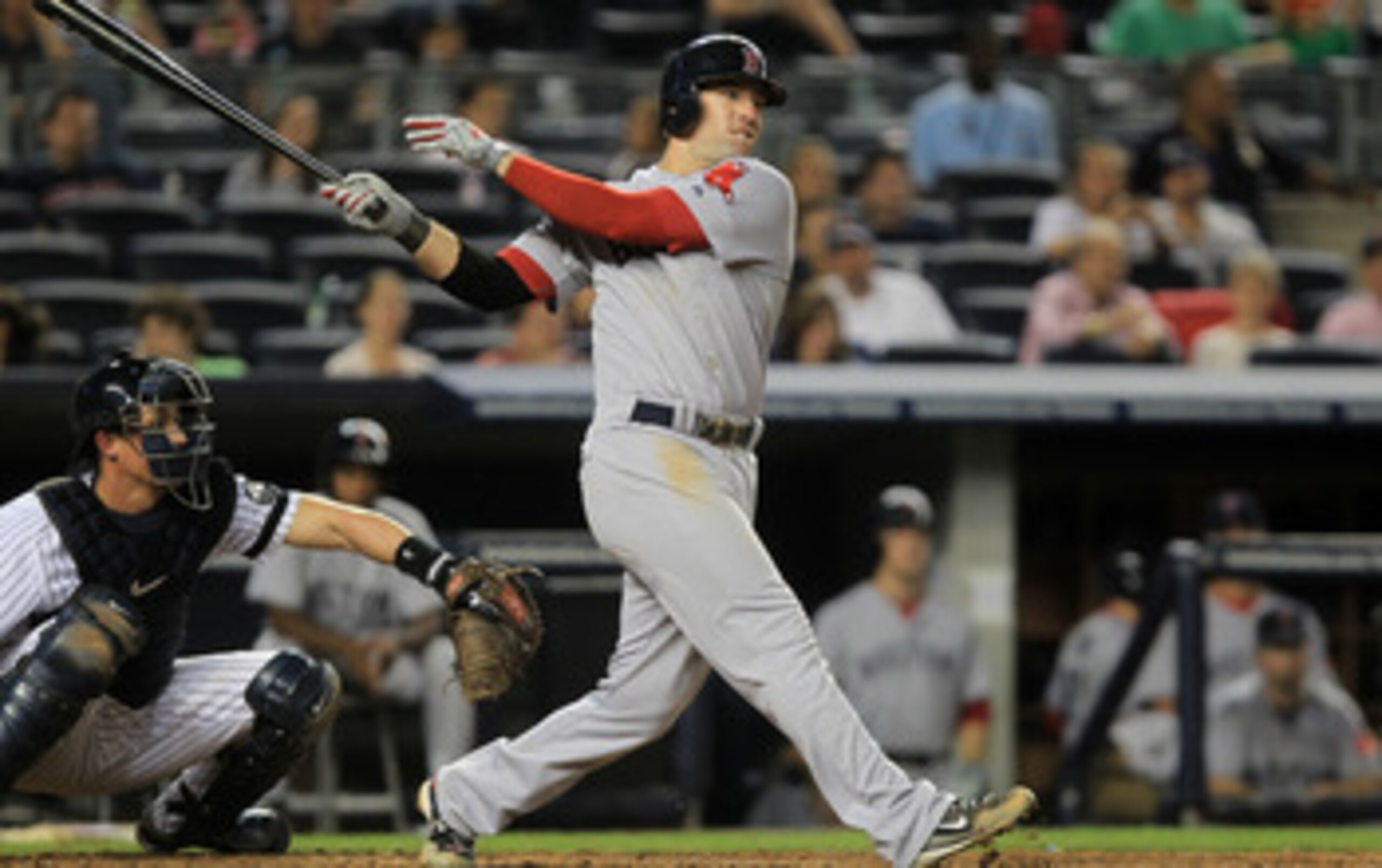 NEW YORK - SEPTEMBER 25: Ryan Kalish #55 of the Boston Red Sox hits a double to get team mate Yamaico Navarro #56 home against the New York Yankees during their game on September 25, 2010 at Yankee Stadium in the Bronx borough of New York City.  (Photo by