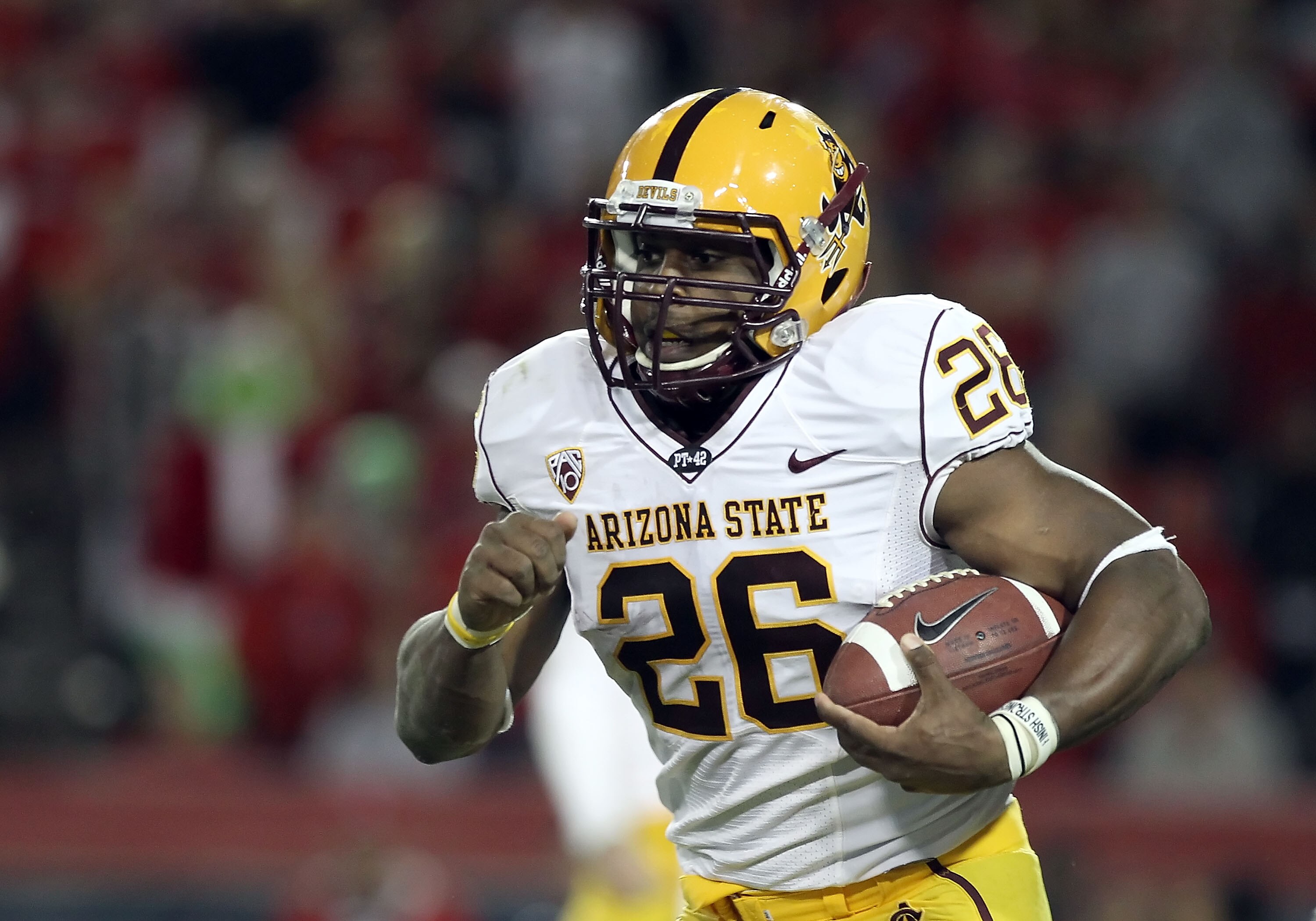 TUCSON, AZ - DECEMBER 02:  Runningback Cameron Marshall #26 of the Arizona State Sun Devils runs with the football during the college football game at Arizona Stadium on December 2, 2010 in Tucson, Arizona. The Sun Devils defeated the Wildcats 30-29 in do