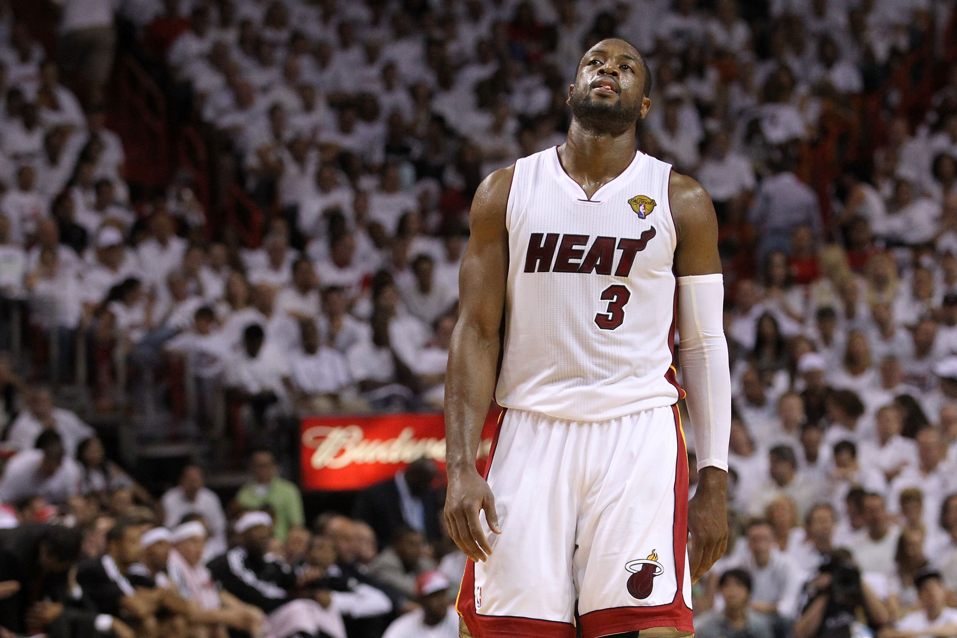 MIAMI, FL - JUNE 12:  Dwyane Wade #3 of the Miami Heat reacts while taking on the Dallas Mavericks in Game Six of the 2011 NBA Finals at American Airlines Arena on June 12, 2011 in Miami, Florida. NOTE TO USER: User expressly acknowledges and agrees that,