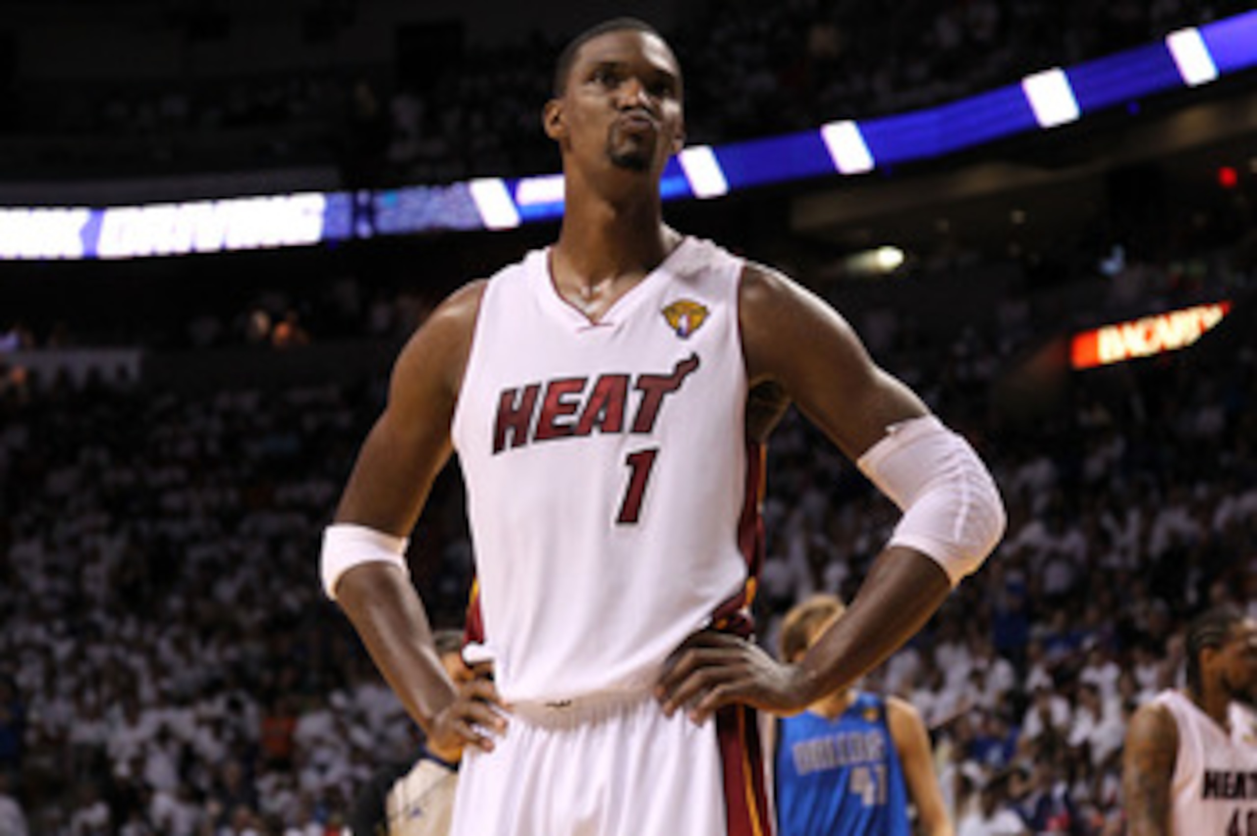 MIAMI, FL - JUNE 12:  Chris Bosh #1 of the Miami Heat looks on late in the fourth quarter while taking on the Dallas Mavericks in Game Six of the 2011 NBA Finals at American Airlines Arena on June 12, 2011 in Miami, Florida. NOTE TO USER: User expressly a