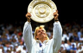 Jul 1990:  Martina Navratilova of the USA holds up the winners'' plate after winning the Wimbledon Championships played at Wimbledon, London, England.  \ Mandatory Credit: Allsport UK /Allsport