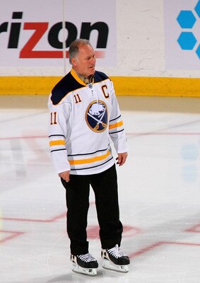BUFFALO, NY - FEBRUARY 23:  Former Buffalo Sabres players Gilbert Perreault #11, Rene Robert #14 and Rick Martin #7 skate out to meet new Sabre owner Terry Pegula (not shown) during pre game ceremonies prior to play against the Atlanta Thrashers at HSBC A