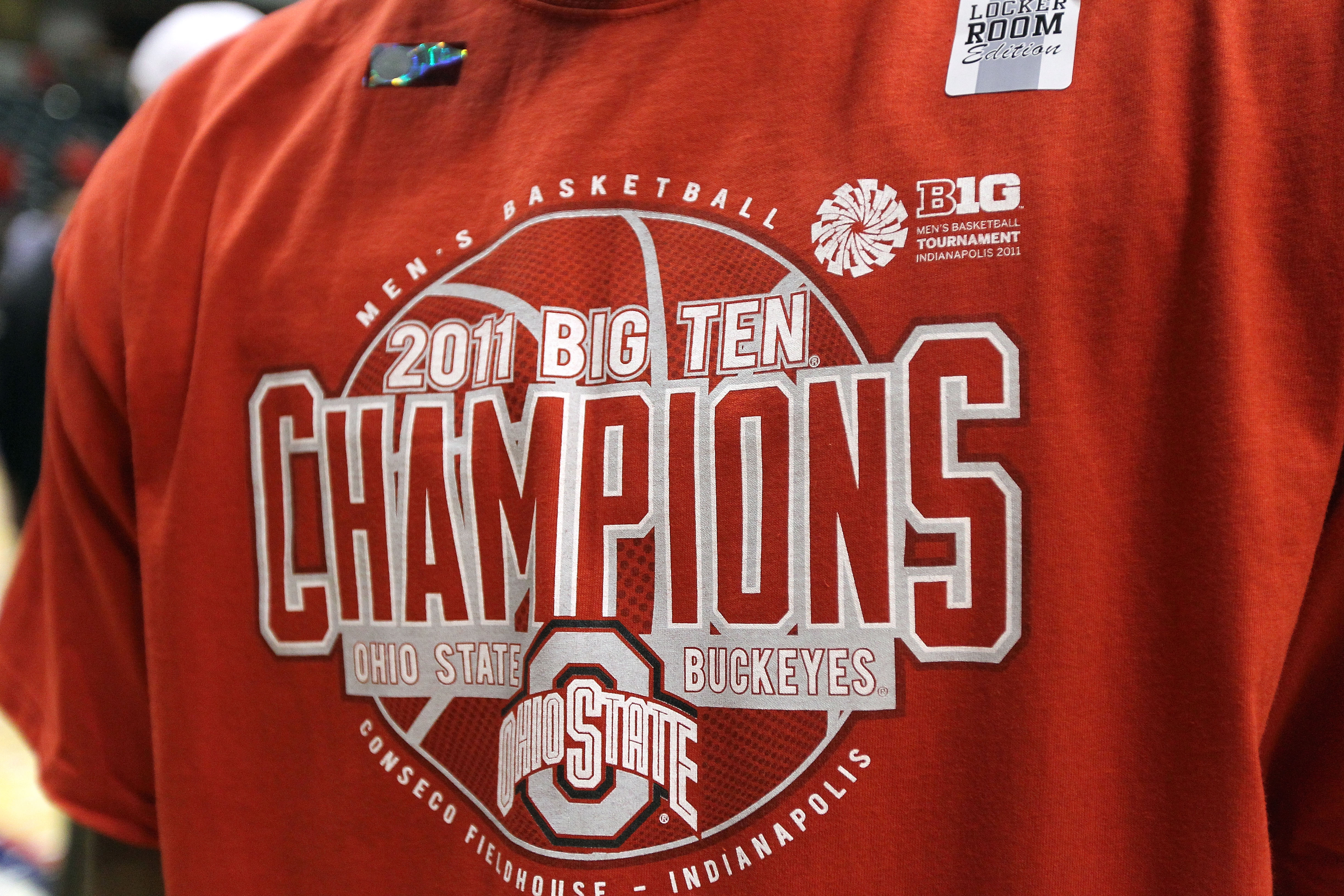 INDIANAPOLIS, IN - MARCH 13:  A detail of a t-shirt which reads Ohio State Buckeyes 2011 Big Ten Champions after they won 71-60 against the Penn State Nittany Lions during the championship game of the 2011 Big Ten Men's Basketball Tournament at Conseco Fi