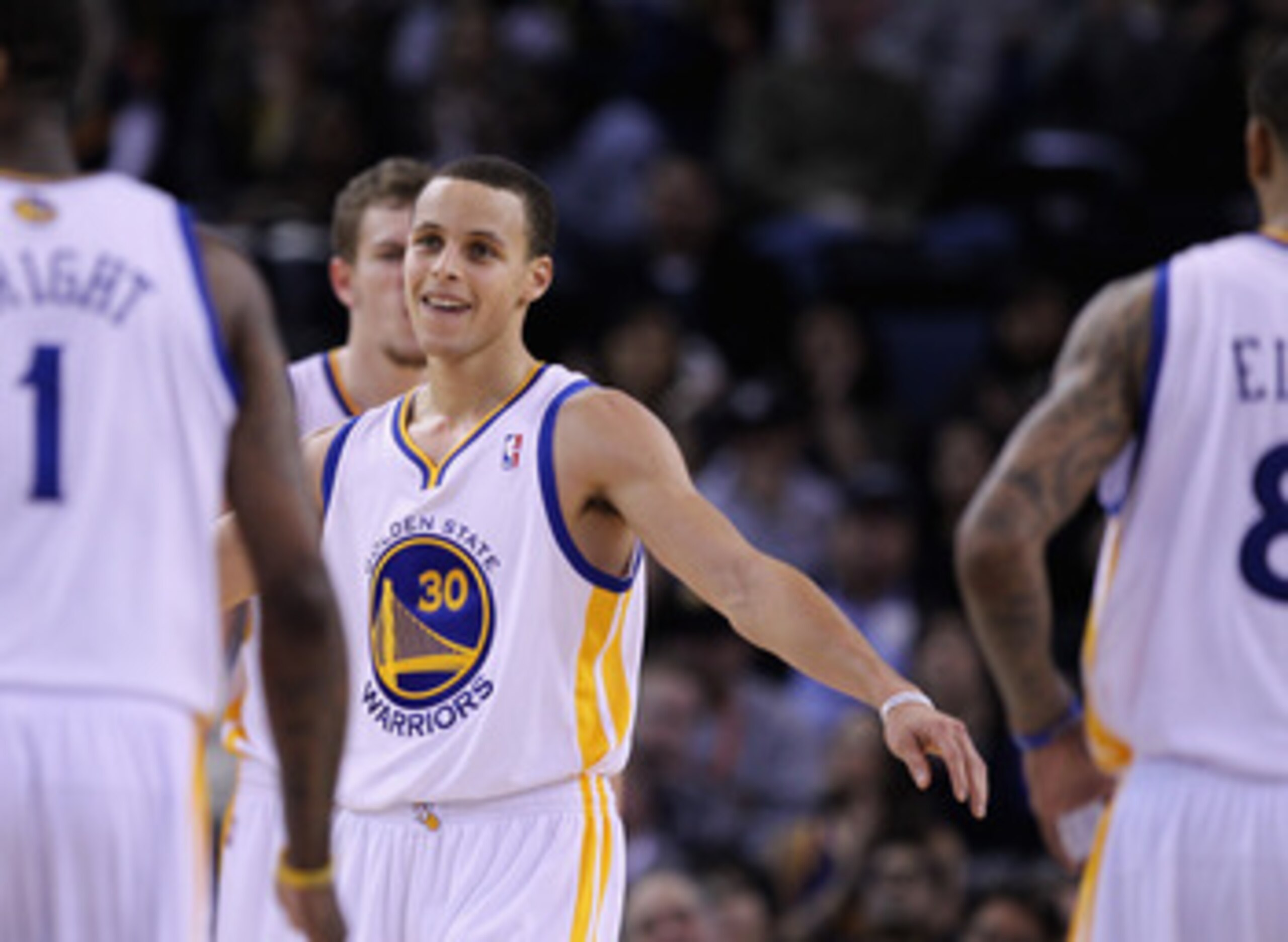 OAKLAND, CA - MARCH 25: Stephen Curry #30 of the Golden State Warriors congratulates his teammates during their game against the Toronto Raptors at Oracle Arena on March 25, 2011 in Oakland, California. NOTE TO USER: User expressly acknowledges and agree OAKLAND, CA - MARCH 25: Stephen Curry #30 of the Golden State Warriors congratulates his teammates during their game against the Toronto Raptors at Oracle Arena on March 25, 2011 in Oakland, California. NOTE TO USER: User expressly acknowledges and agree