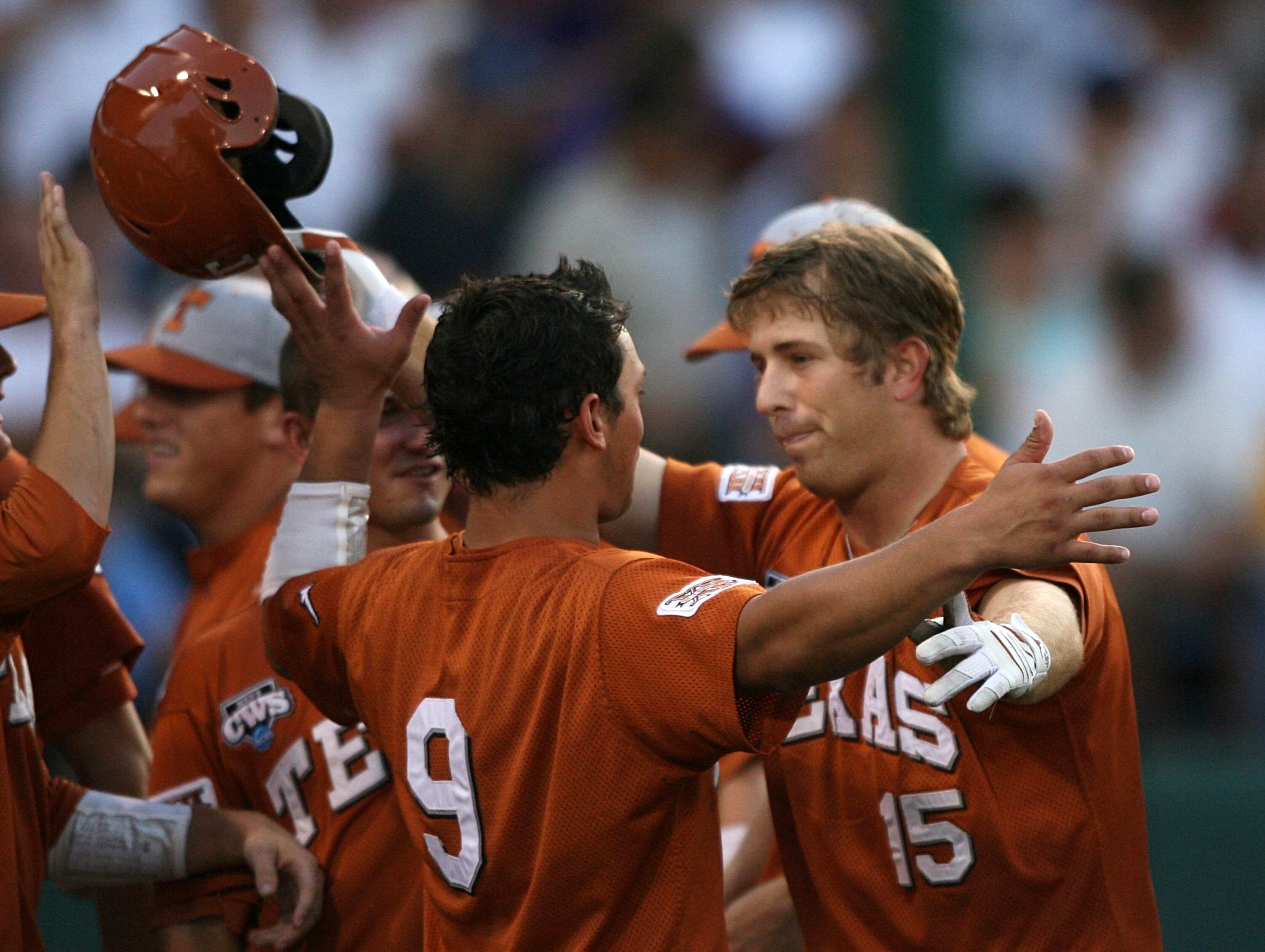 OMAHA, NE - JUNE 23:  (R-L) Russell Moldenhauer #15 of the Texas Longhorns celebrates with teammate Kris Connor #9 after Moldenhauer hit a third inning homerun against the Louisiana State University Tigers during Game 2 of the 2009 NCAA College World Seri