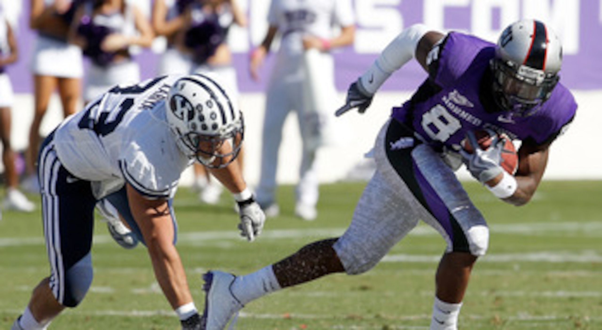 FORT WORTH, TX - OCTOBER 16:  Wide receiver Jeremy Kerley #85 of the TCU Horned Frogs carries the ball against defensice back Bryan Kariya #33 of the BYU Cougars at Amon G. Carter Stadium on October 16, 2010 in Fort Worth, Texas.  TCU beat BYU 31-3.  (Pho