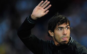 MANCHESTER, ENGLAND - MAY 23:  Carlos Tevez of Manchester City waves to the fans during the Manchester City FA Cup Winners Parade at the City of Manchester stadium on May 23, 2011 in Manchester, United Kingdom.  (Photo by Jamie McDonald/Getty Images)