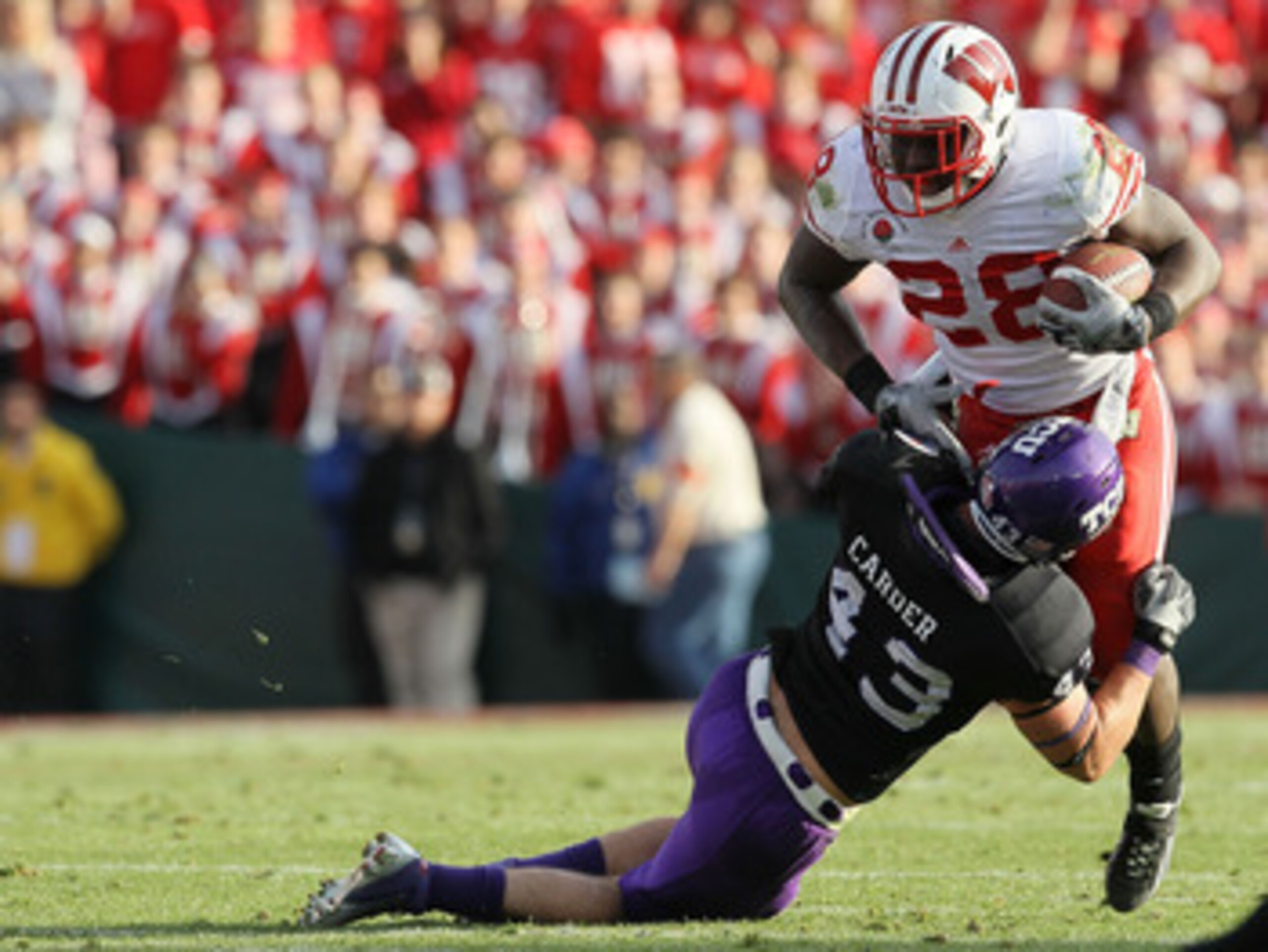PASADENA, CA - JANUARY 01:  Running back Montee Ball #28 of the Wisconsin Badgers rushes with the ball against the TCU Horned Frogs during the 97th Rose Bowl game on January 1, 2011 in Pasadena, California.  (Photo by Stephen Dunn/Getty Images)