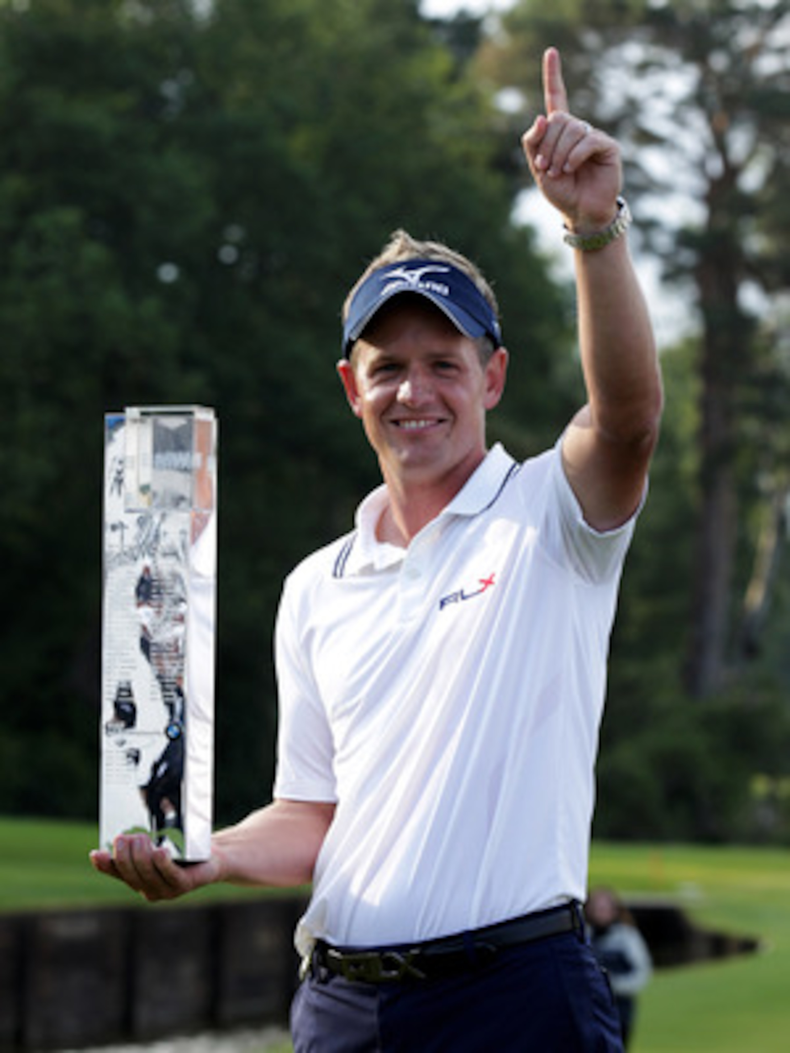VIRGINIA WATER, ENGLAND - MAY 29:  Luke Donald of England holds the trophy following his victory in a playoff on the 18th green, which also secured him the Number one World ranking during the final round of the BMW PGA Championship  at the Wentworth Club