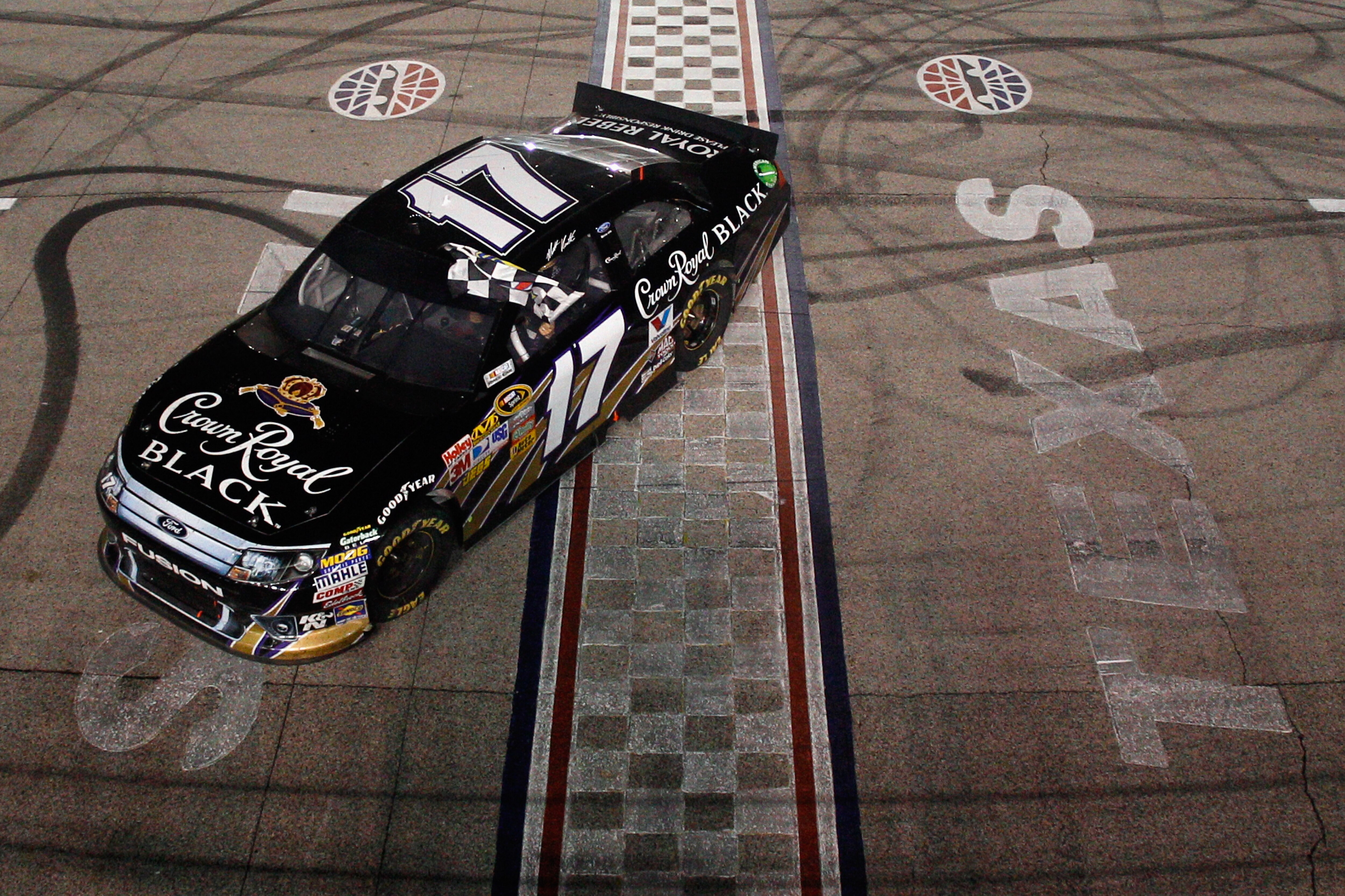 FORT WORTH, TX - APRIL 09:  Matt Kenseth, driver of the #17 Crown Royal Black Ford, celebrates with a burnout after winning the NASCAR Sprint Cup Series Samsung Mobile 500 at Texas Motor Speedway on April 9, 2011 in Fort Worth, Texas.  (Photo by Chris Gra