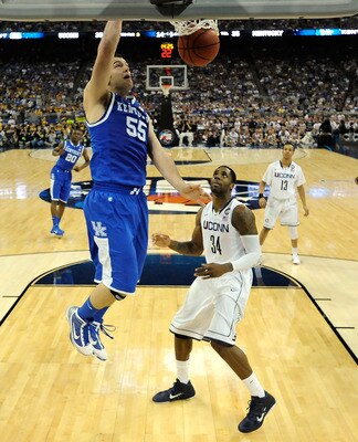 HOUSTON, TX - APRIL 02: Josh Harrellson #55 of the Kentucky Wildcats dunks the ball against Alex Oriakhi #34 of the Connecticut Huskies during the National Semifinal game of the 2011 NCAA Division I Men's Basketball Championship at Reliant Stadium on Apr HOUSTON, TX - APRIL 02: Josh Harrellson #55 of the Kentucky Wildcats dunks the ball against Alex Oriakhi #34 of the Connecticut Huskies during the National Semifinal game of the 2011 NCAA Division I Men's Basketball Championship at Reliant Stadium on Apr