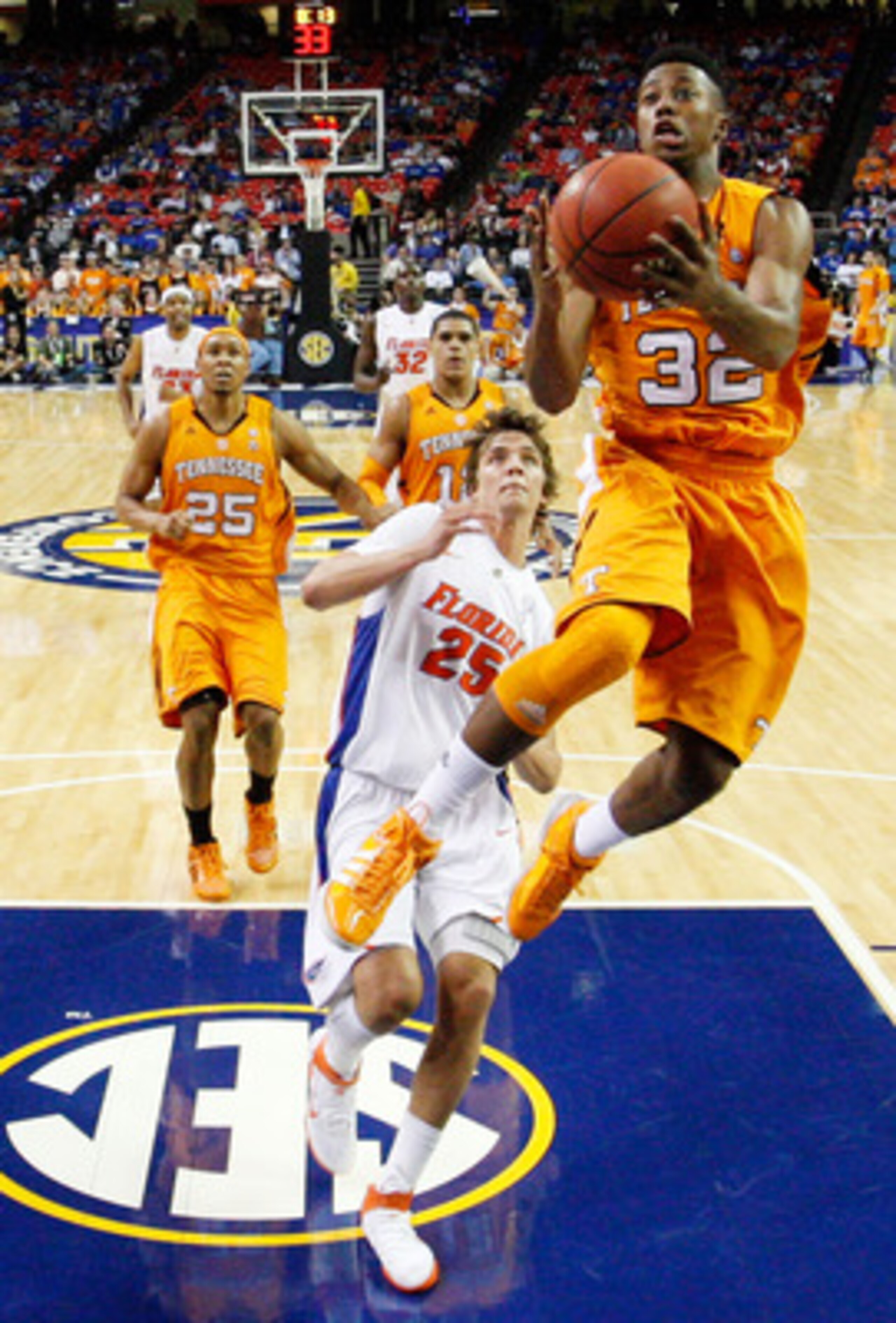 ATLANTA, GA - MARCH 11:  Scotty Hopson #32 of the Tennessee Volunteers shoots infront of Chandler Parsons #25 of the Florida Gators during the quarterfinals of the SEC Men's Basketball Tournament at Georgia Dome on March 11, 2011 in Atlanta, Georgia.  (Ph
