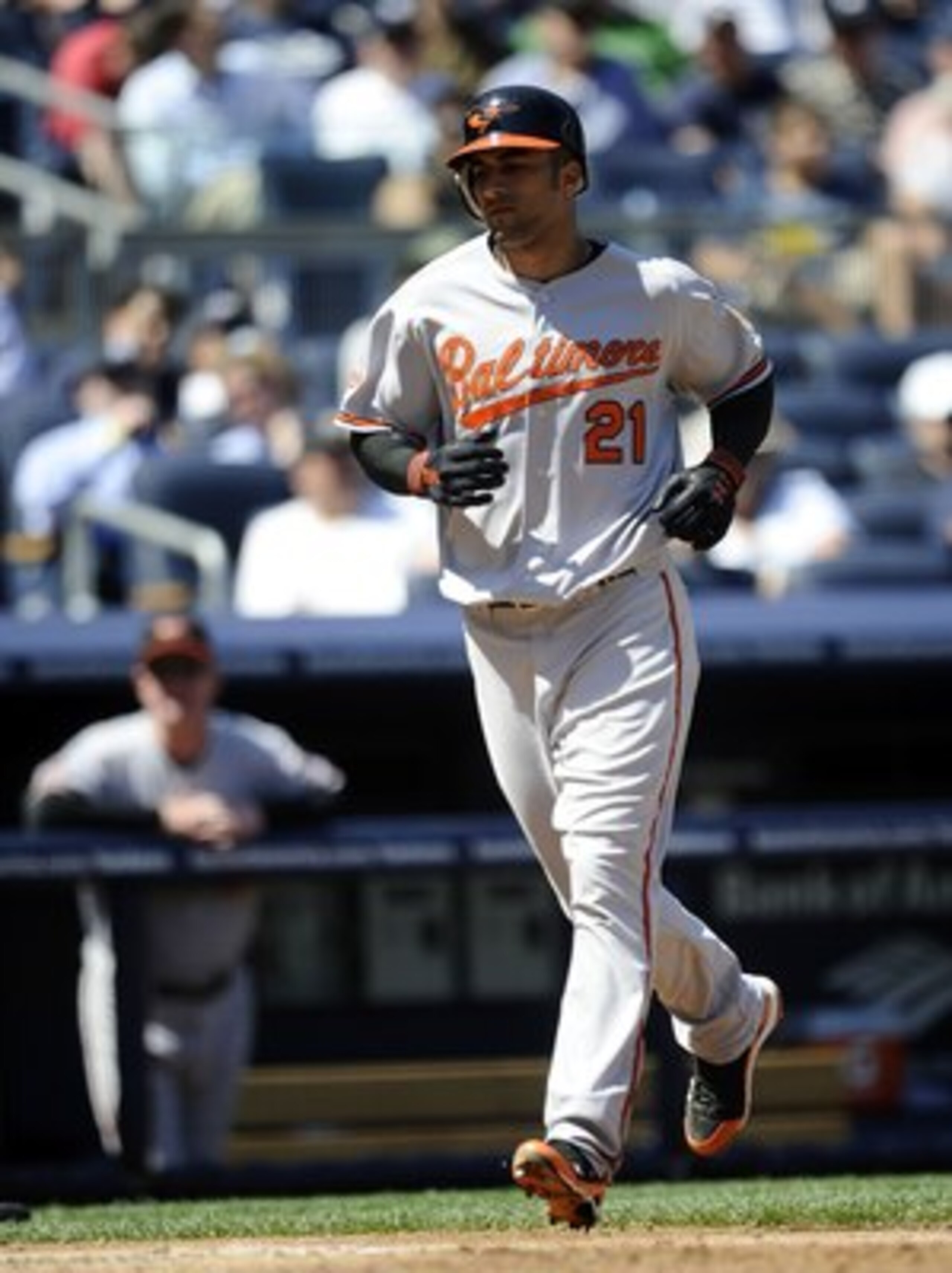 NEW YORK - MAY 05:  Nick Markakis #21 of the Baltimore Orioles scores against the New York Yankees at Yankee Stadium on May 5, 2010 in the Bronx borough of New York City  (Photo by Jeff Zelevansky/Getty Images)