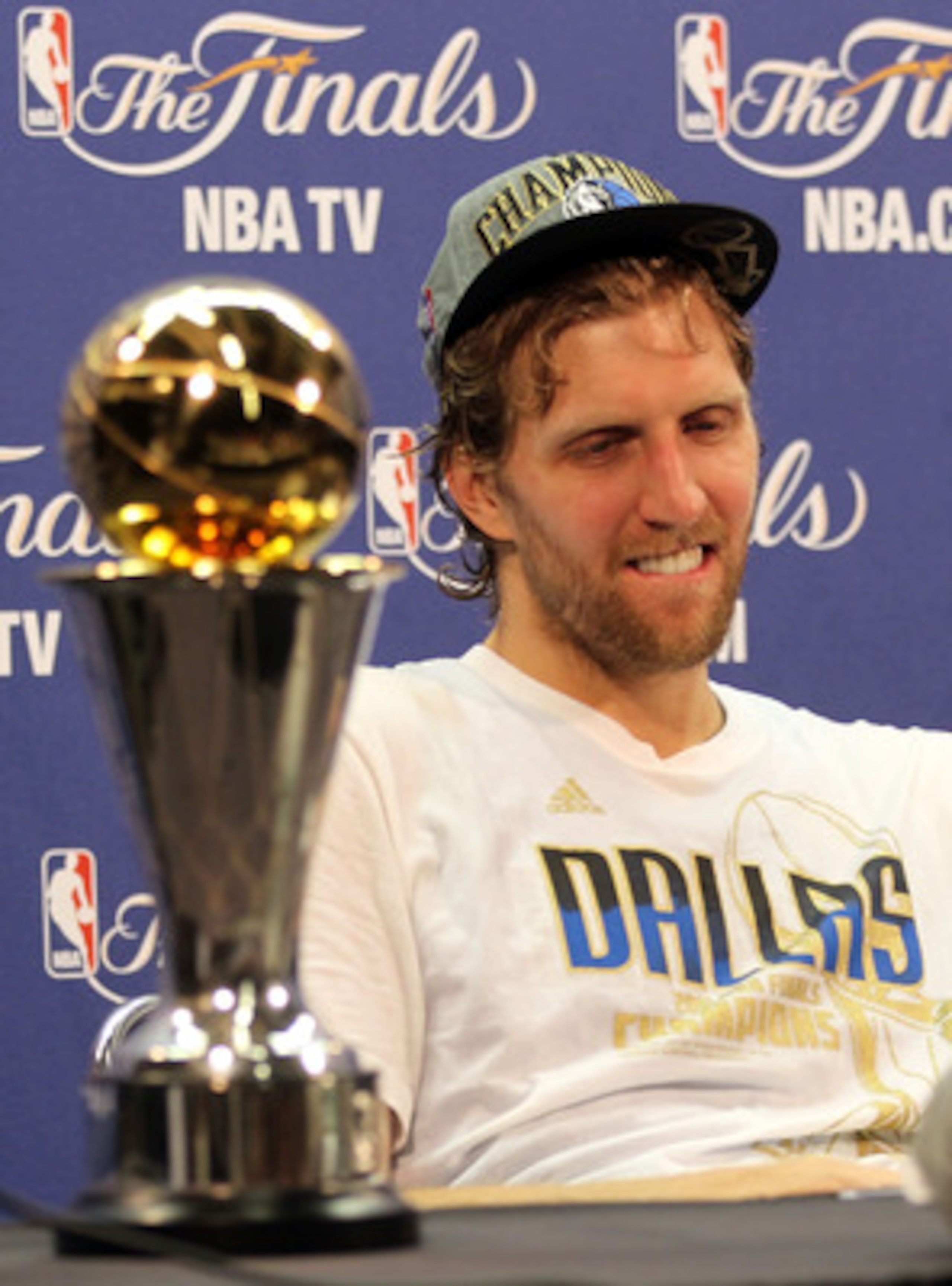 MIAMI, FL - JUNE 12:  Finals MVP Dirk Nowitzki #41 of the Dallas Mavericks answers questions form the media at a post game press conference with the Bill Russell Finals MVP trophy after the Mavericks won 105-95 against the Miami Heat in Game Six of the 20