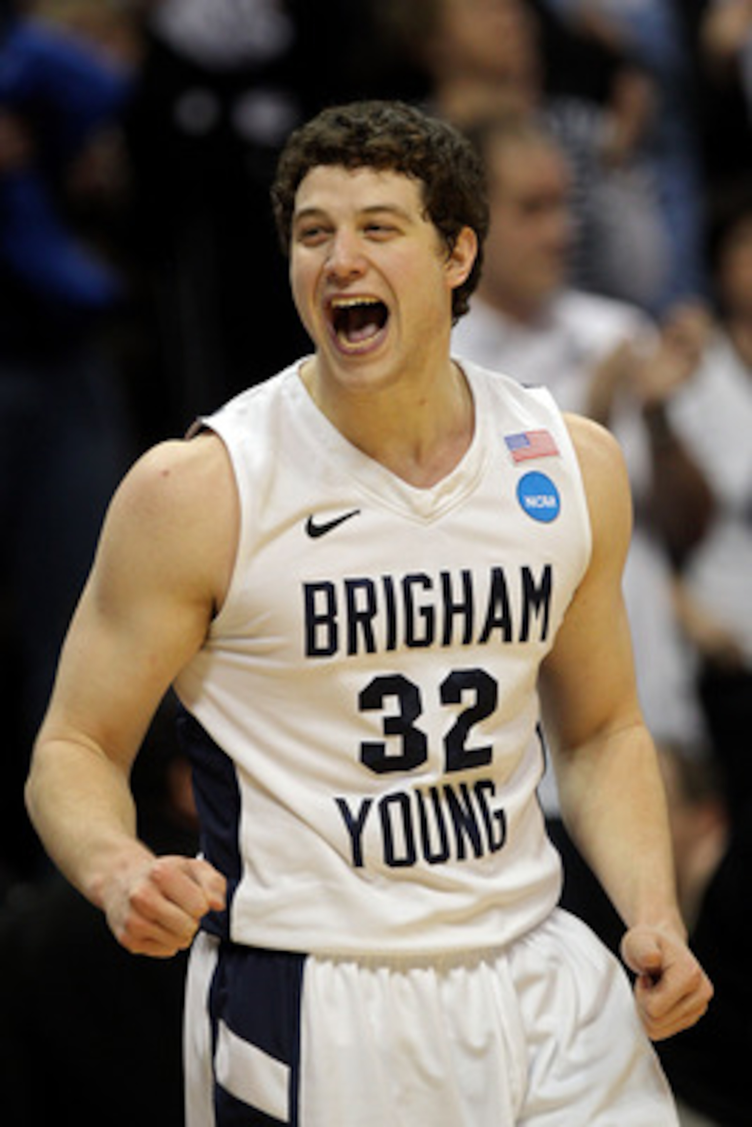 DENVER, CO - MARCH 19:  Jimmer Fredette #32 of the Brigham Young Cougars celebrates after defeating the Gonzaga Bulldogs during the third round of the 2011 NCAA men's basketball tournament at Pepsi Center on March 19, 2011 in Denver, Colorado.  (Photo by 